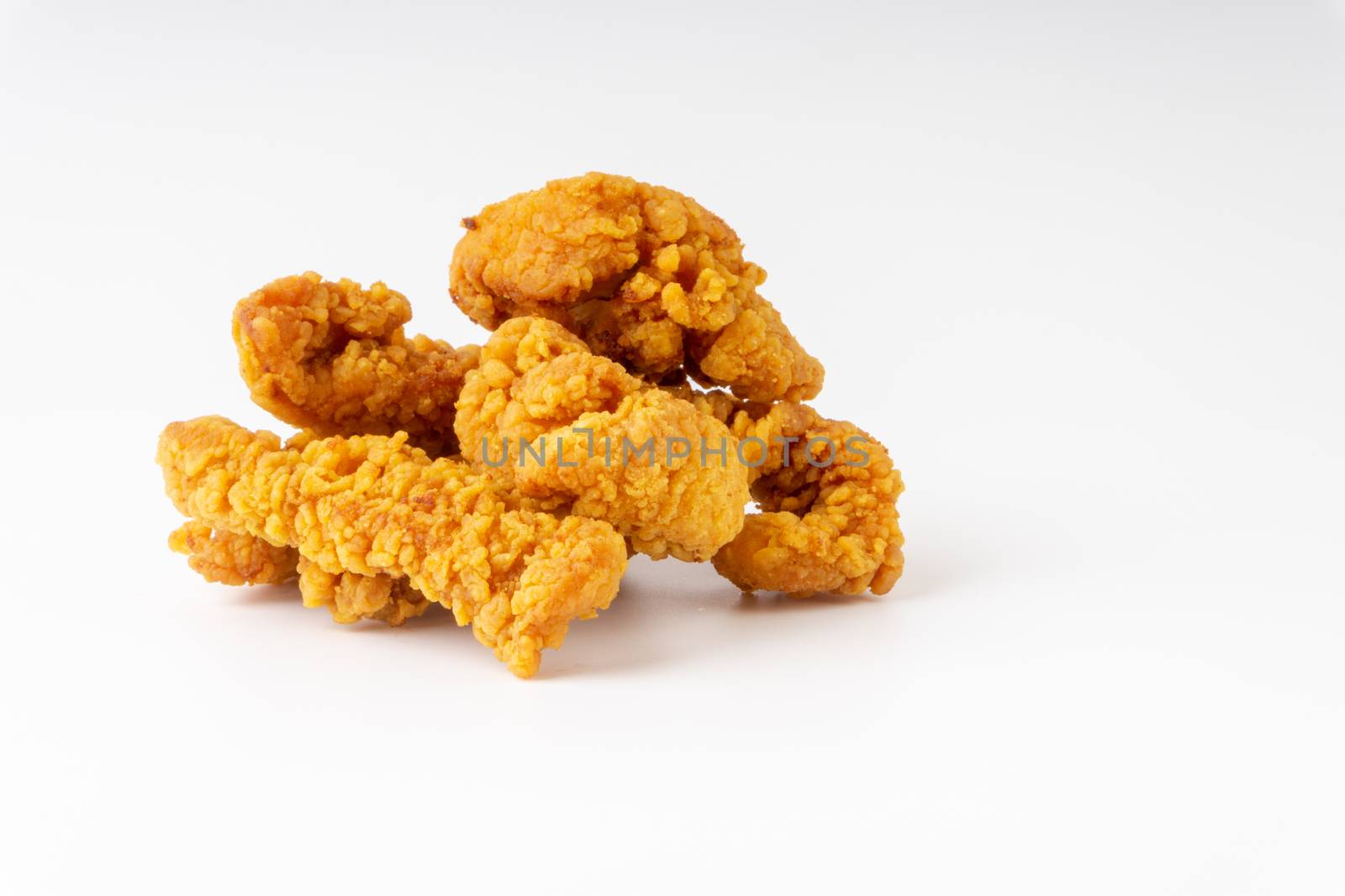 Fried breaded chicken fillet isolated on white background 