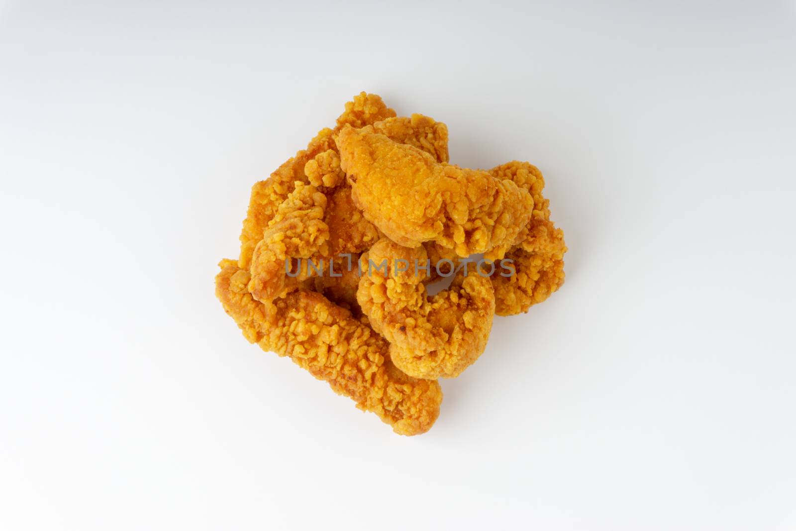 Fried breaded chicken fillet isolated on white background  by silverwings