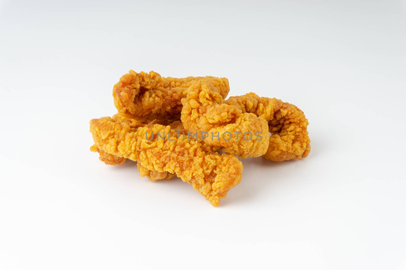 Fried breaded chicken fillet isolated on white background 