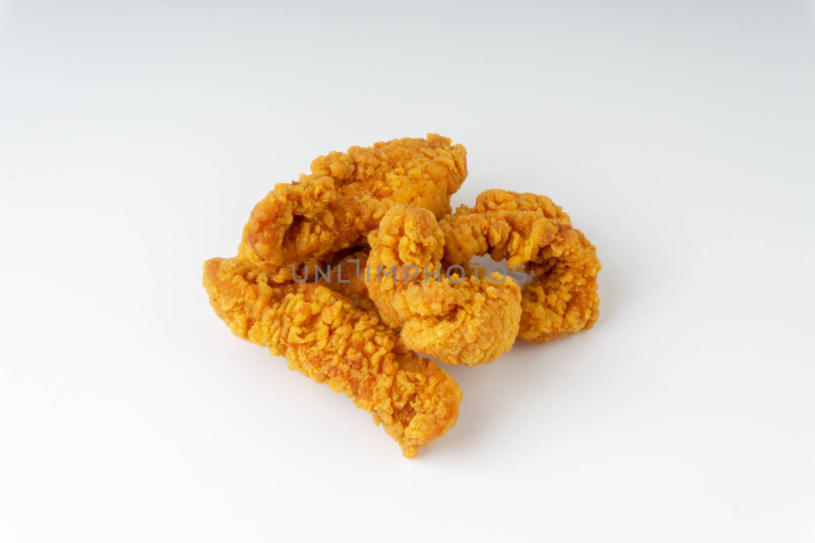 Fried breaded chicken fillet isolated on white background 