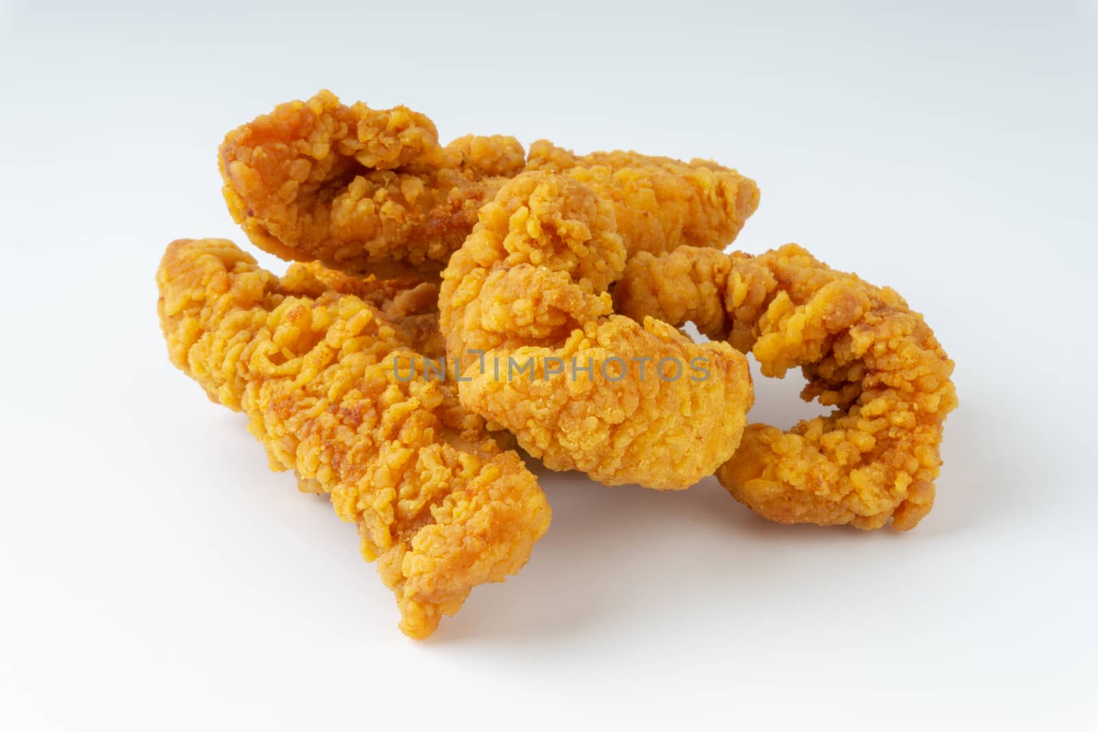 Fried breaded chicken fillet isolated on white background  by silverwings