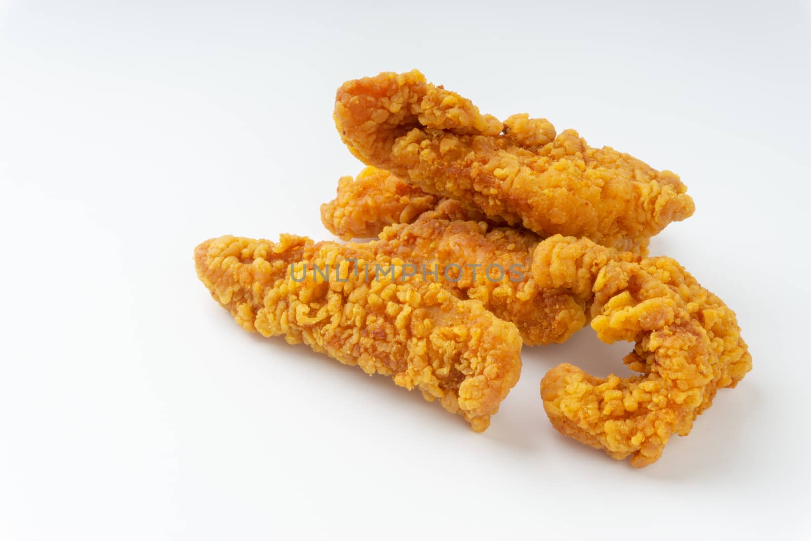 Fried breaded chicken fillet isolated on white background  by silverwings