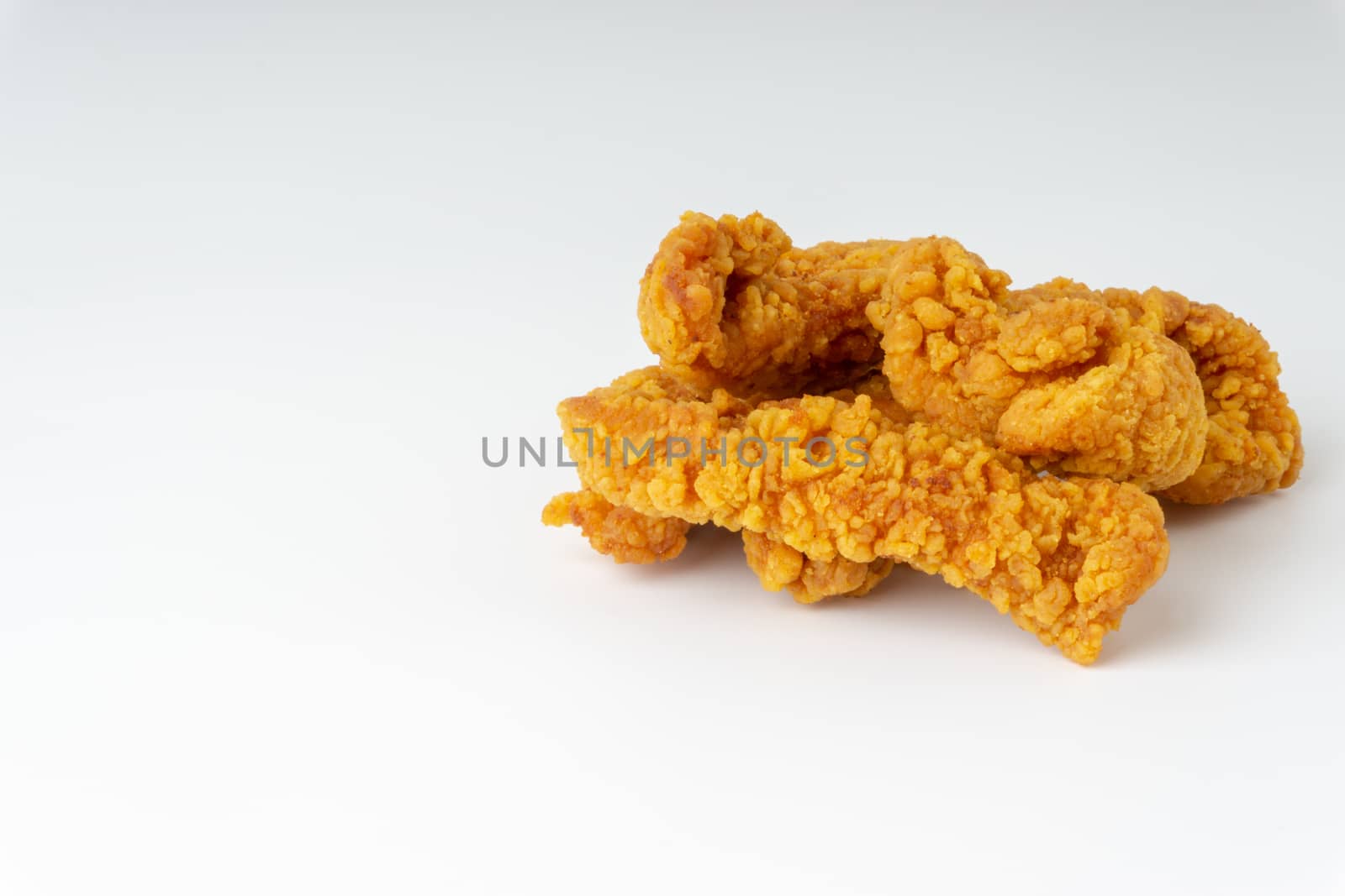 Fried breaded chicken fillet isolated on white background  by silverwings