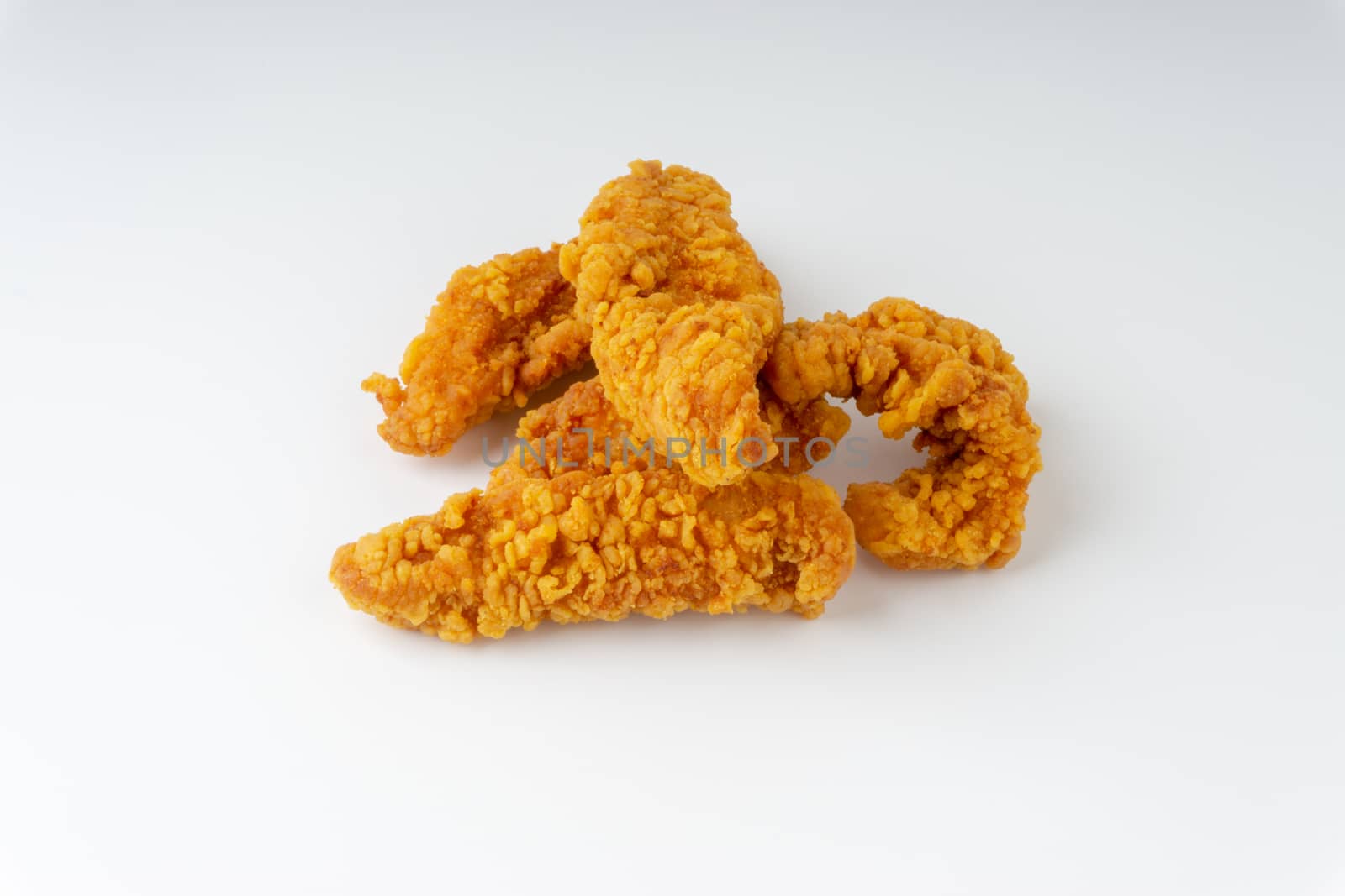 Fried breaded chicken fillet isolated on white background 