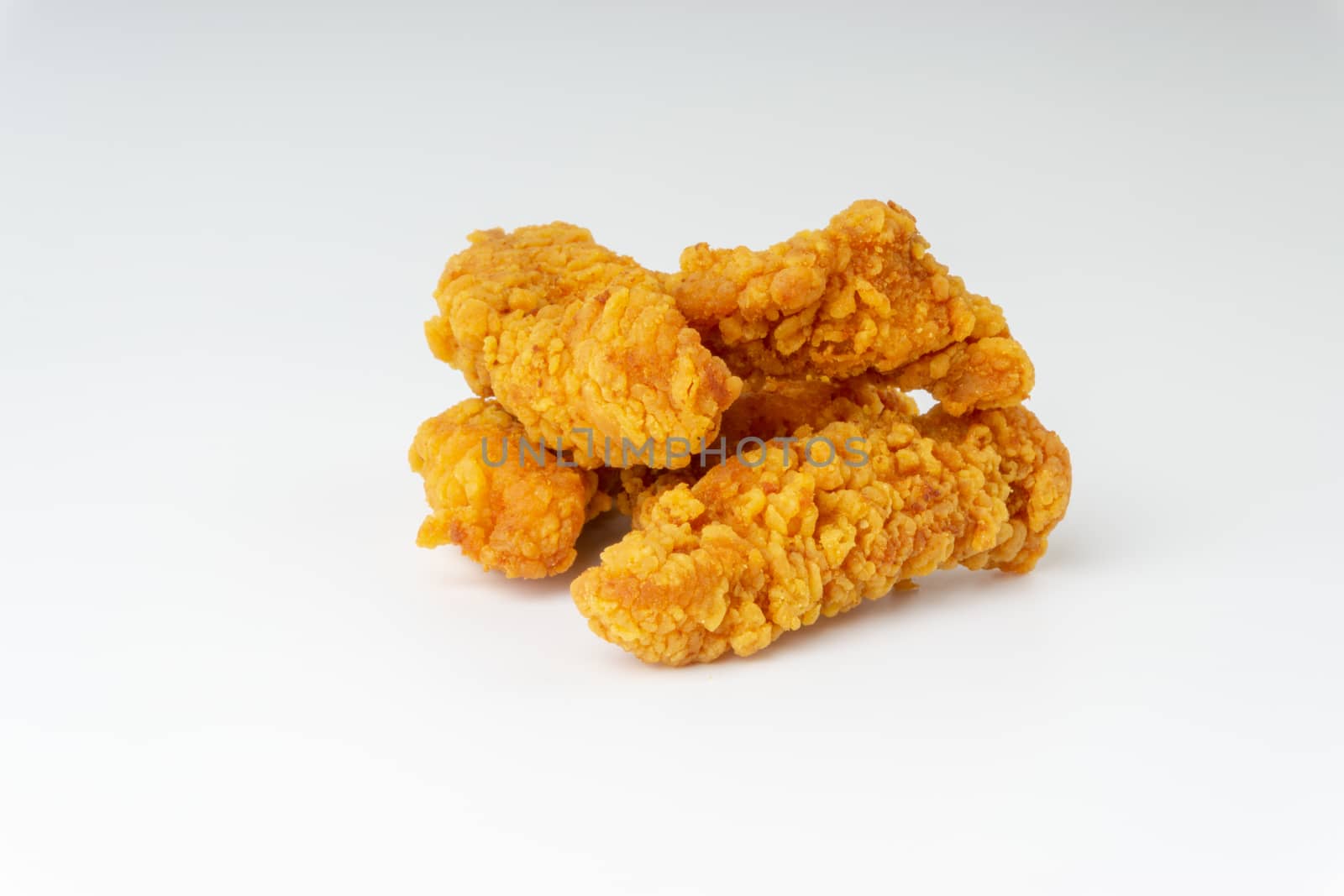 Fried breaded chicken fillet isolated on white background  by silverwings