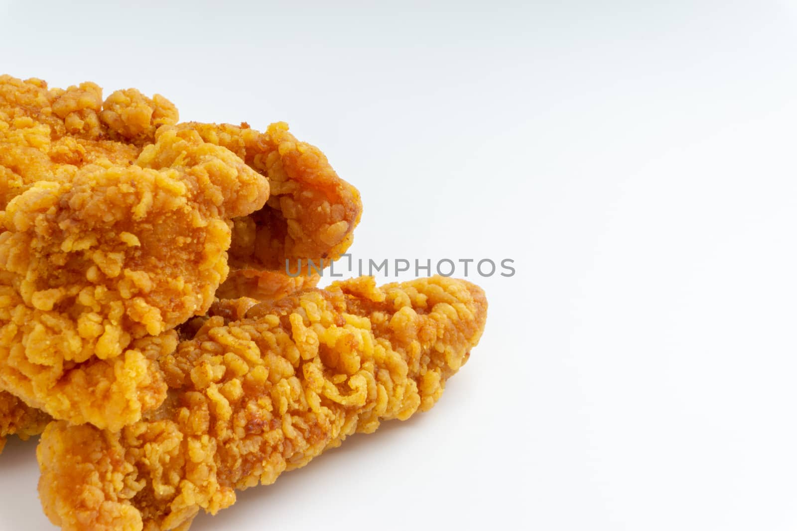 Fried breaded chicken fillet isolated on white background 