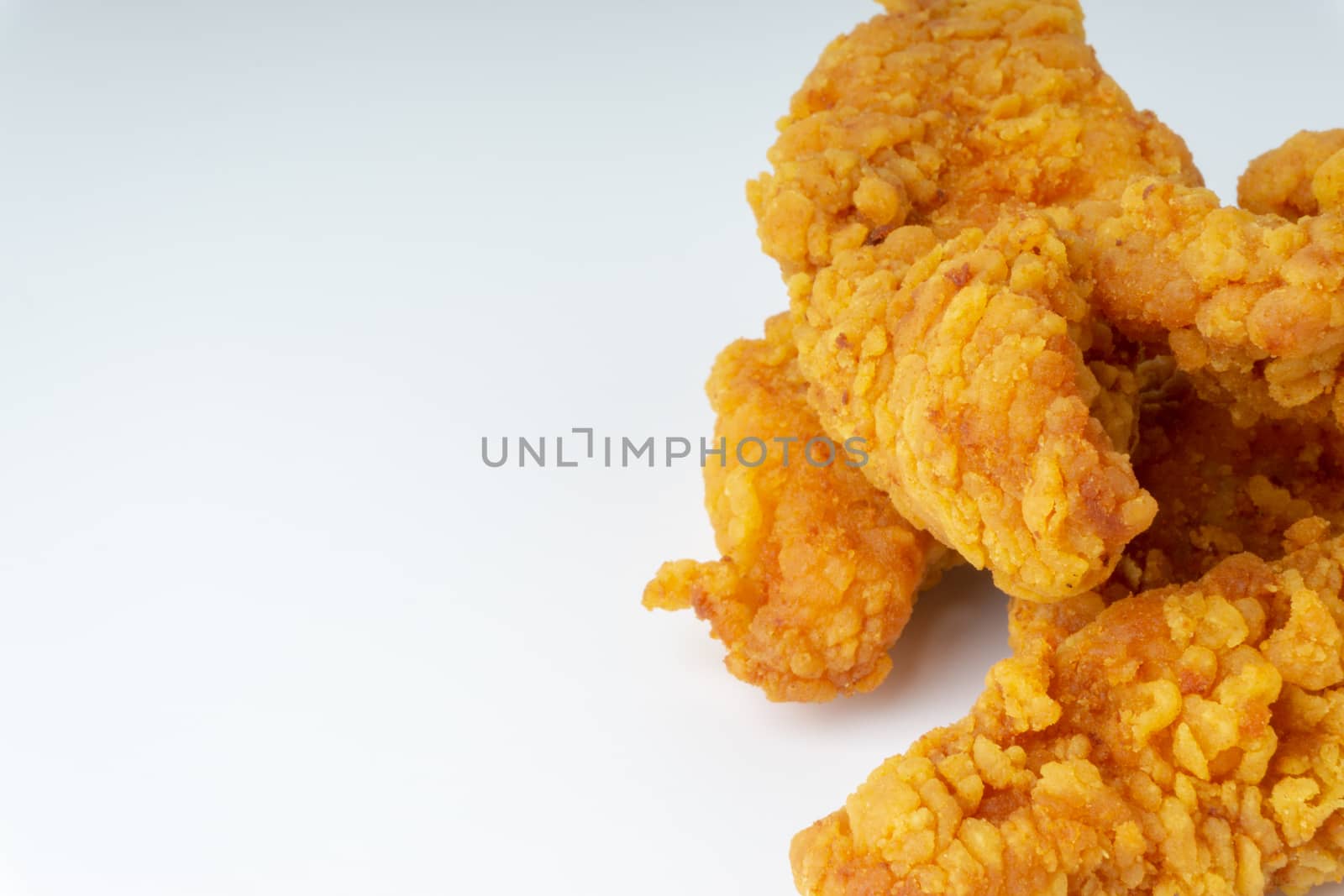 Fried breaded chicken fillet isolated on white background 