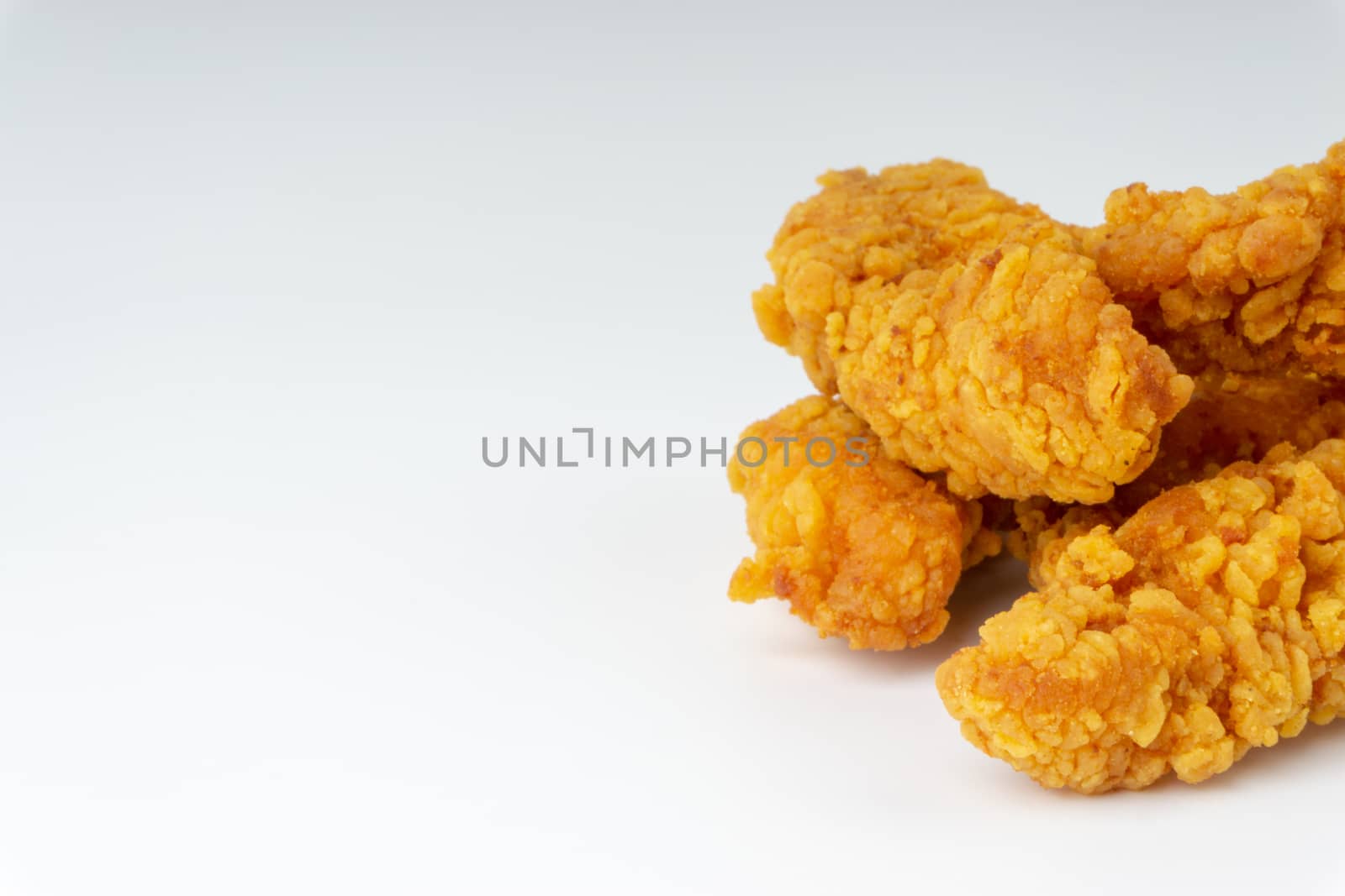 Fried breaded chicken fillet isolated on white background  by silverwings