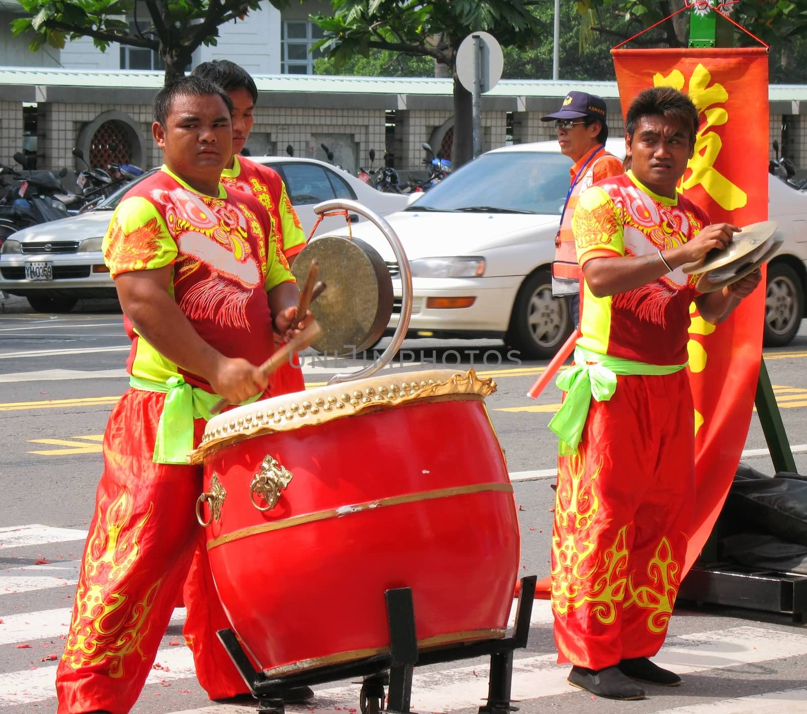 -- using various percussion instruments at a ceremony