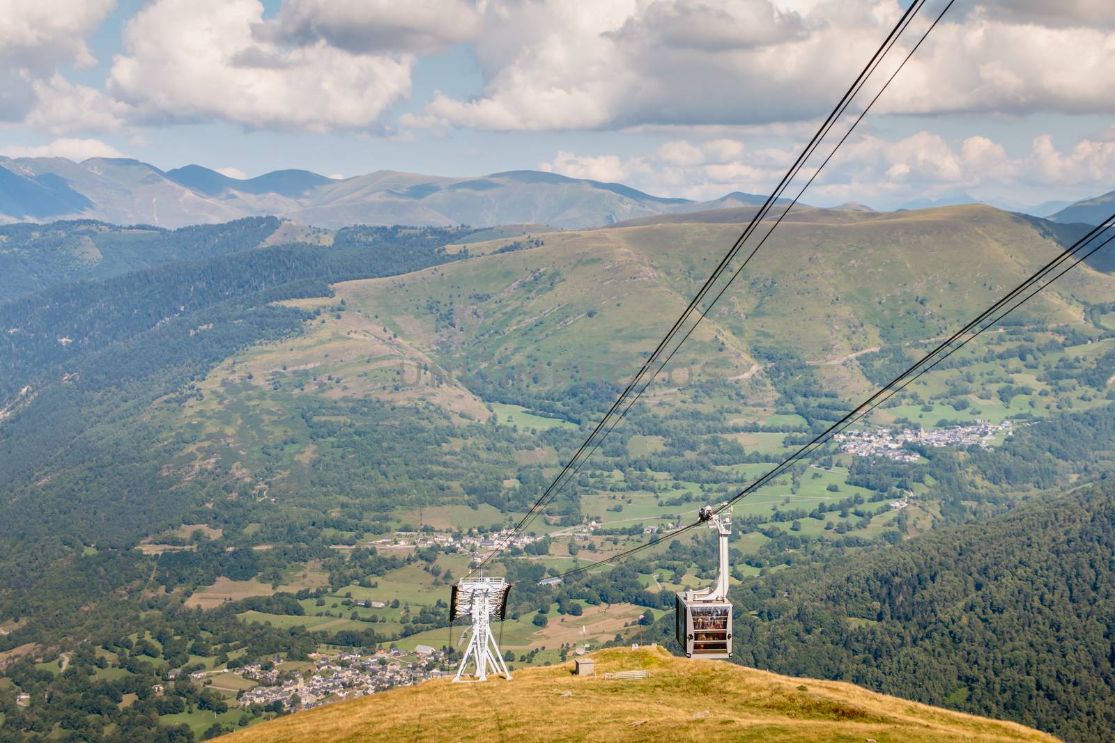 grey cable car that goes up the mountain in the Pyrenees