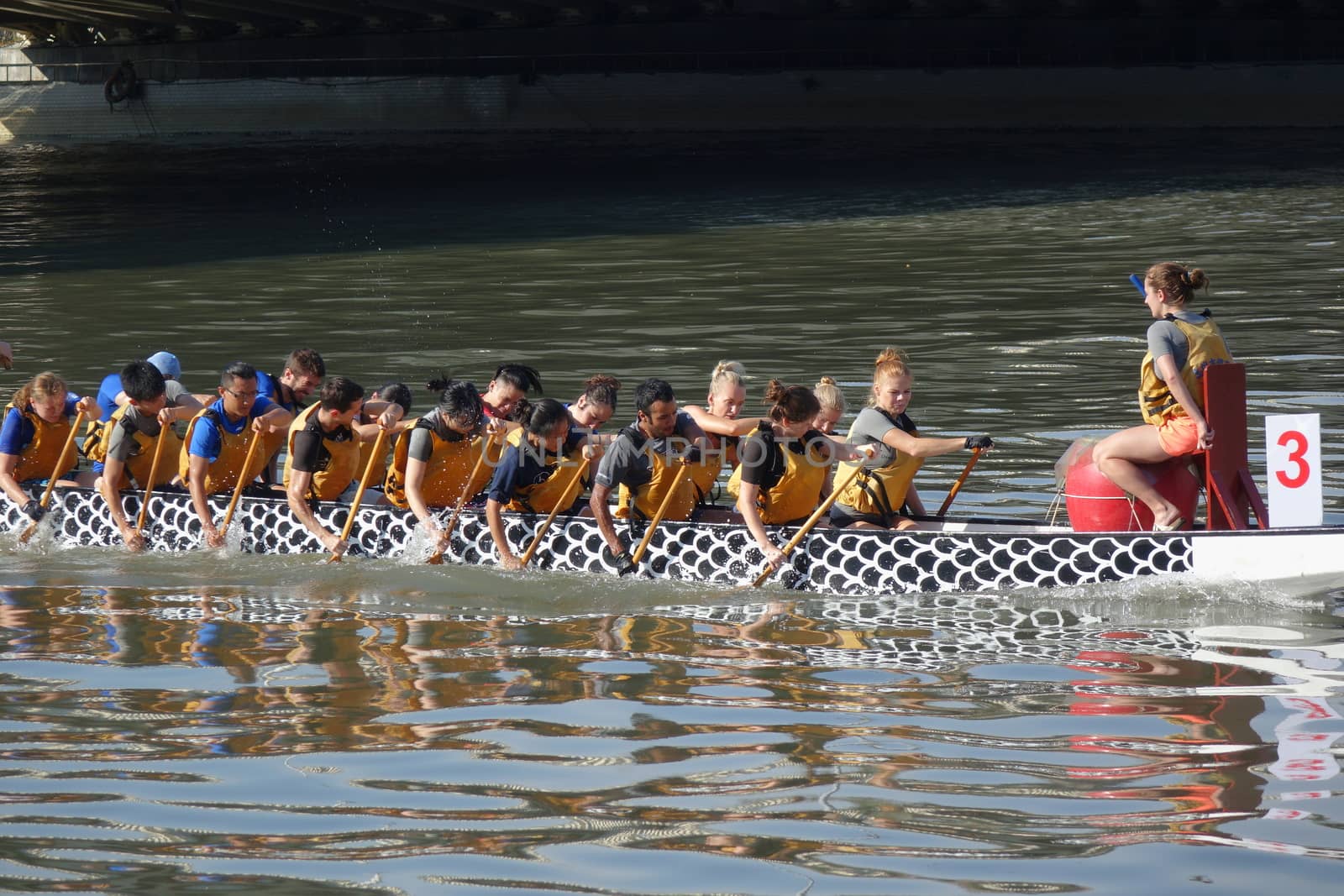 KAOHSIUNG, TAIWAN -- MAY 21, 2017: A team of foreign students trains on the Love River in preparation for the upcoming Dragon Boat Festival.