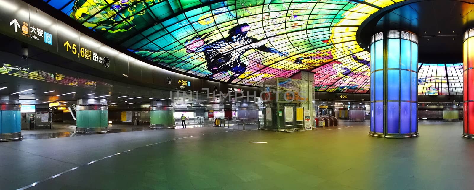 KAOHSIUNG, TAIWAN -- SEPTEMBER 13, 2018: The concourse of the Formosa Boulevard Station of the Kaohsiung MRT features a large public art glass installation.
