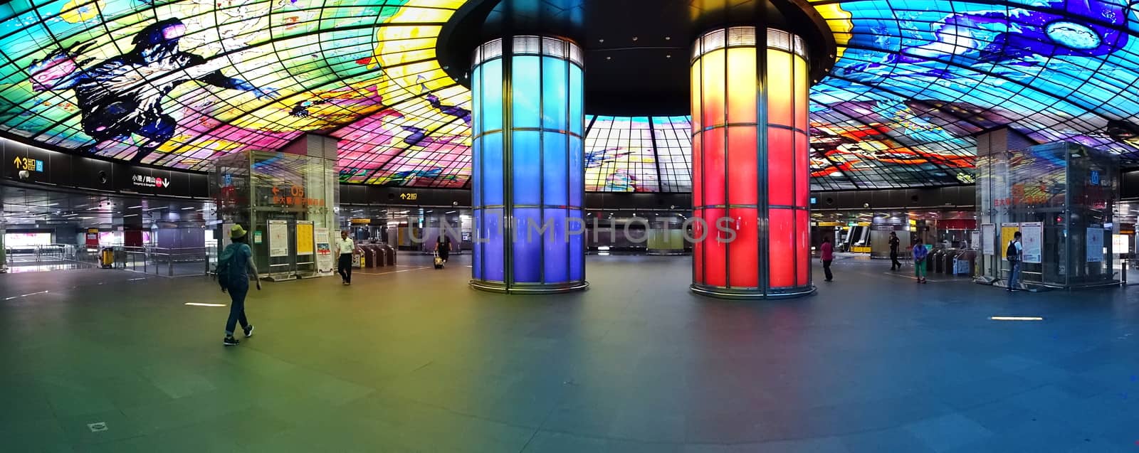 KAOHSIUNG, TAIWAN -- SEPTEMBER 13, 2018: The concourse of the Formosa Boulevard Station of the Kaohsiung MRT features a large public art glass installation.