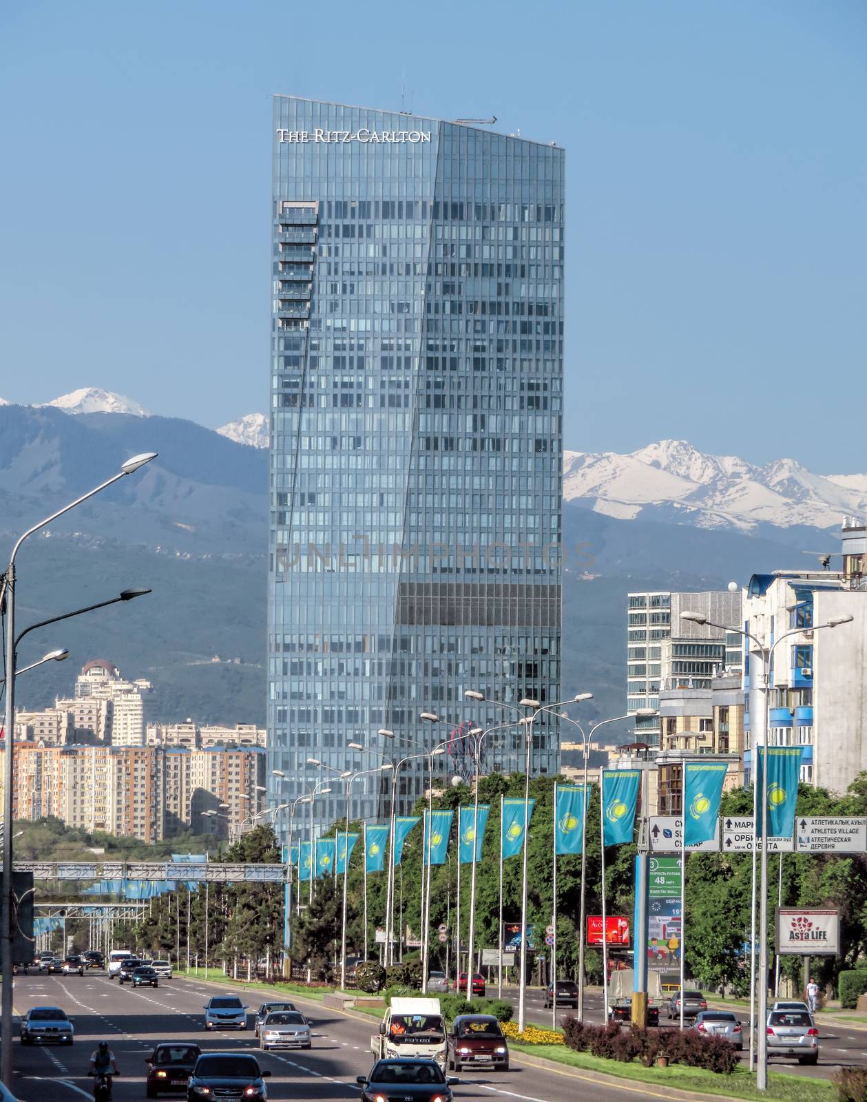 ALMATY, KAZAKHSTAN - MAY 14, 2017: The Ritz-Carlton Hotel from Al-Farabi street in Almaty, Kazakhstan. It is a complex of buildings of Business Centre of Esentai Tower.

Almaty, Kazakhstan - May 14, 2017: The Ritz-Carlton Hotel from Al-Farabi street in Almaty, Kazakhstan. It is a complex of buildings of Business Centre of Esentai Tower.