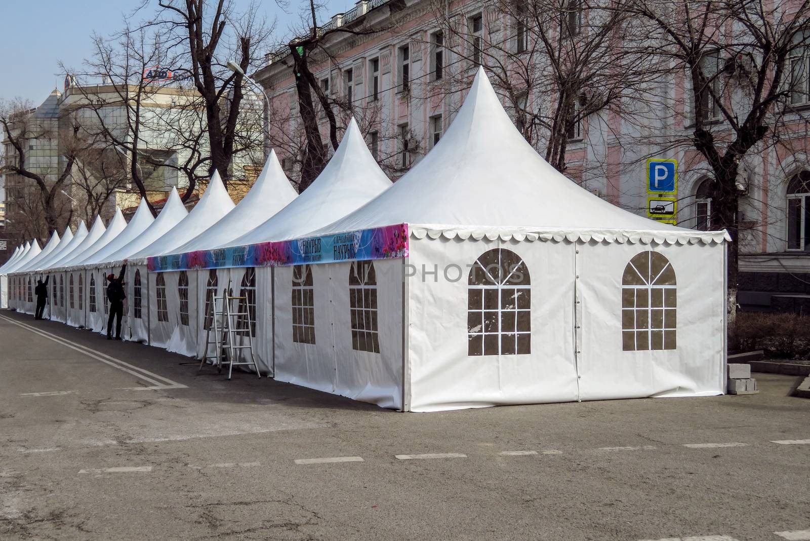 ALMATY, KAZAKHSTAN - MARCH 21, 2017: Market tents on the street in Almaty, Kazakhstan

Almaty, Kazakhstan - March 21, 2017: Market tents on the street in Almaty, Kazakhstan