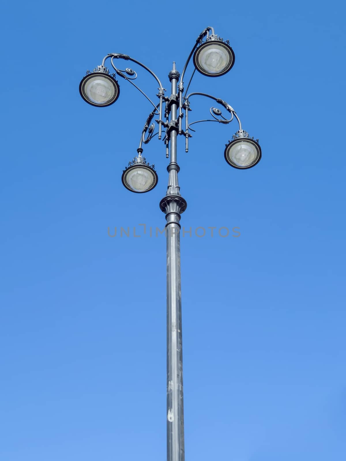 Street lamp with national kazakh ornament over blue sky