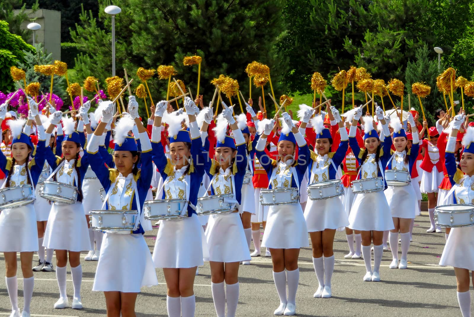 ALMATY, KAZAKHSTAN - JUNE 1, 2017: Solemn parade of children's and youth musical orchestras and ensembles on the Republic Square. More than 5,000 schoolchildren took part in the parade.

Almaty, Kazakhstan - June 1, 2017: Solemn parade of children's and youth musical orchestras and ensembles on the Republic Square. More than 5,000 schoolchildren of the megapolis took part in the parade.