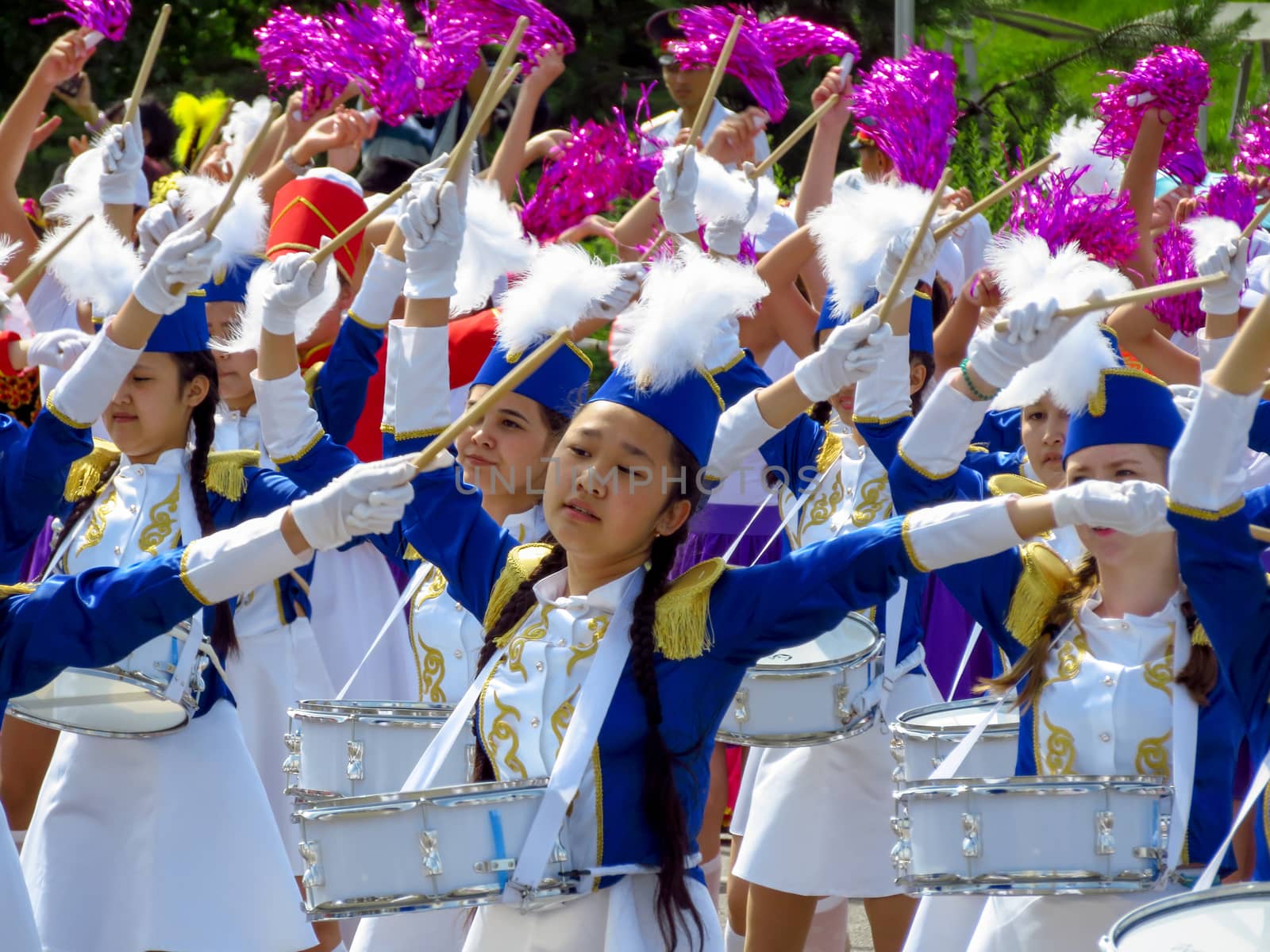 ALMATY, KAZAKHSTAN - JUNE 1, 2017: Solemn parade of children's and youth musical orchestras and ensembles on the Republic Square. More than 5,000 schoolchildren of the megapolis took part in the parade.

Almaty, Kazakhstan - June 1, 2017: Solemn parade of children's and youth musical orchestras and ensembles on the Republic Square. More than 5,000 schoolchildren of the megapolis took part in the parade.