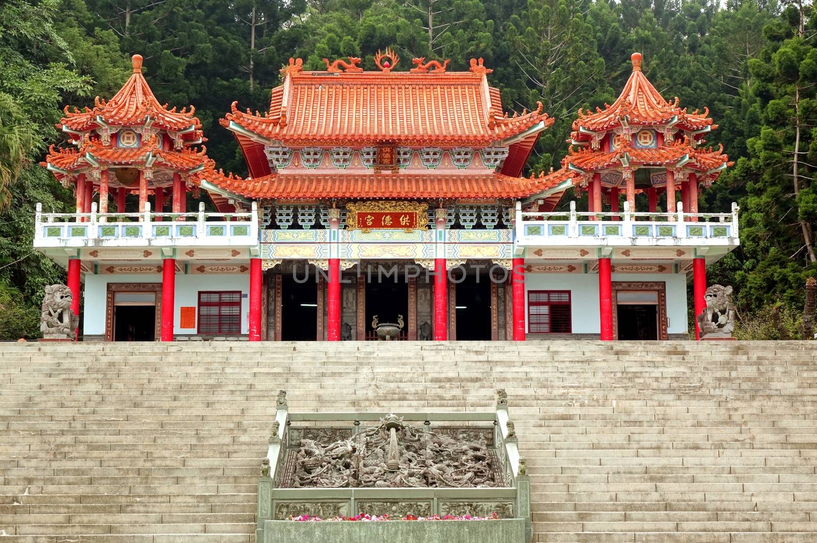 KAOHSIUNG, TAIWAN -- JANUARY 30, 2015:  The traditional Gong De Temple in the foothills of Liu-Yi Mountain is surrounded by dense forests.
