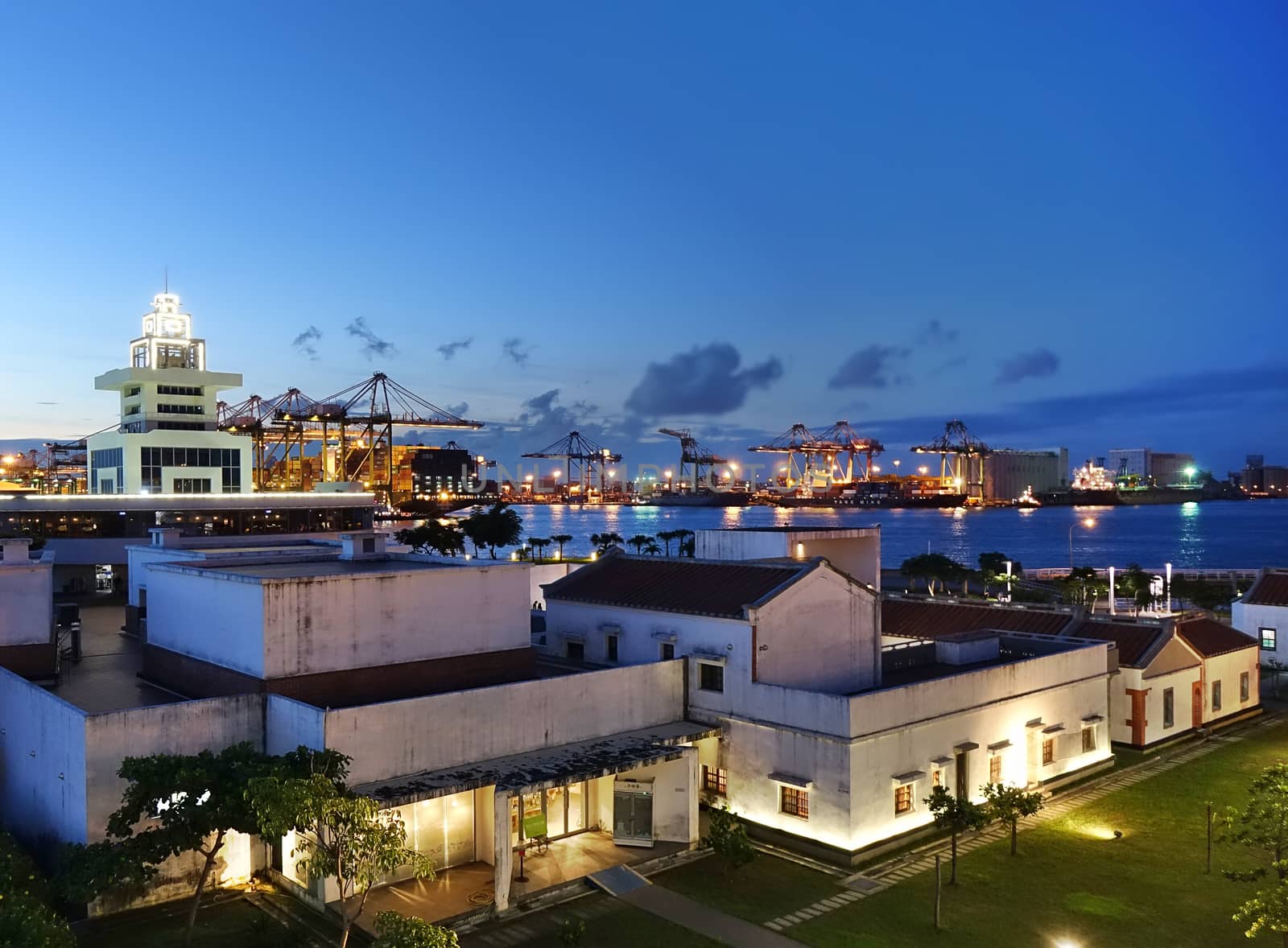 KAOHSIUNG, TAIWAN -- JUNE 2, 2019: Evening view of the Hongmaogang Cultural Park with the container port in the background.
