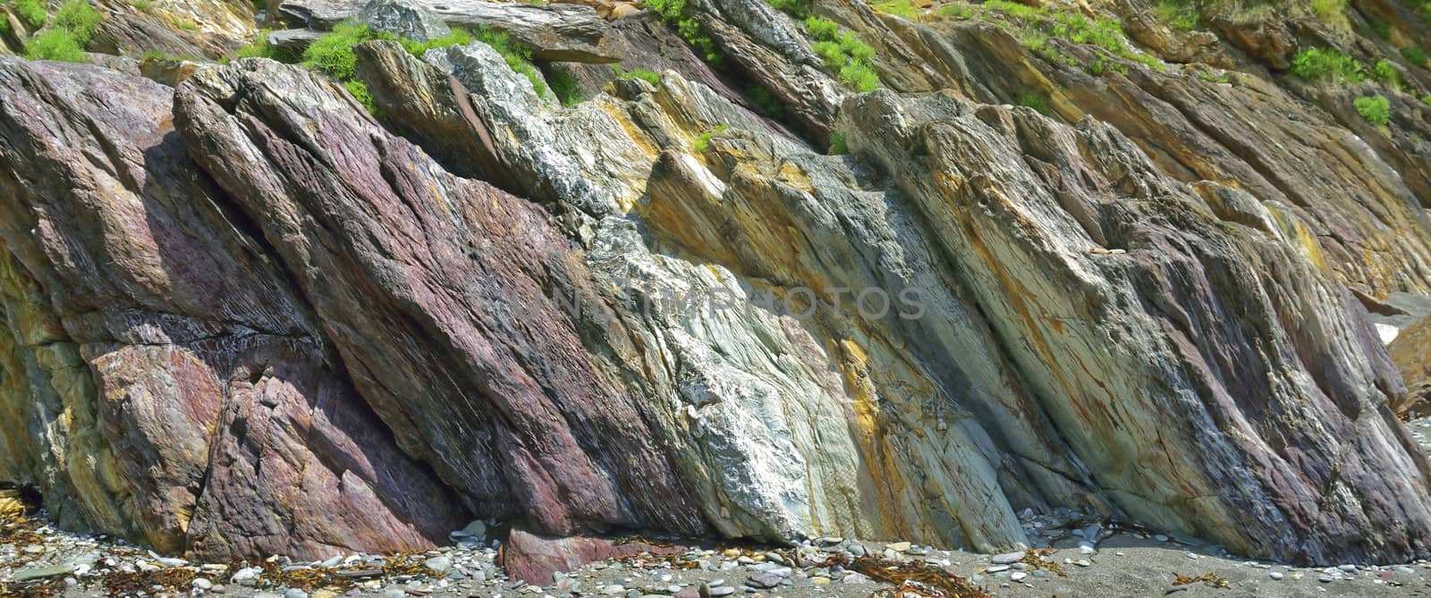Image of a section of the cliffs/ rocks at Carylon Bay on the Coast of Cornwall, UK.
