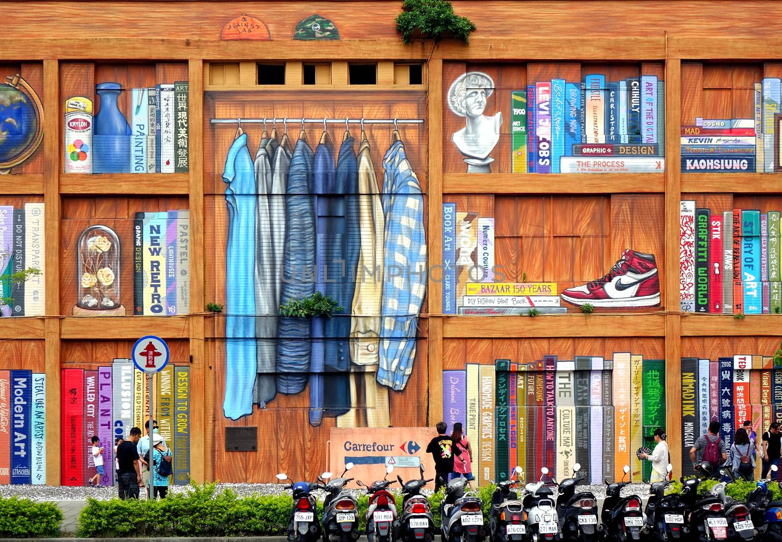 KAOHSIUNG, TAIWAN -- JULY 14, 2017: The facade is painted to resemble a giant book shelf as part of a public art installation.