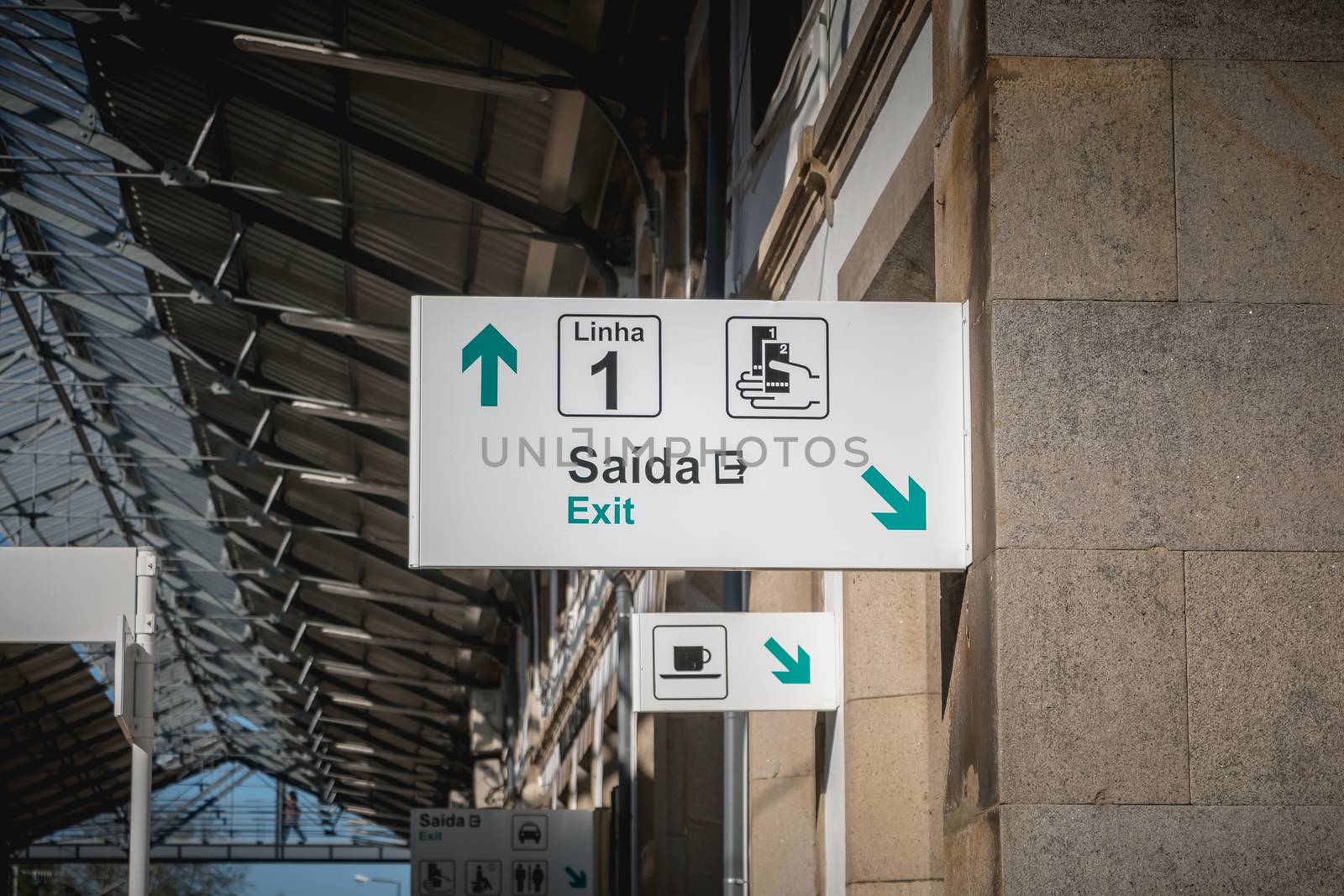 Viana do Castelo, Portugal - May 10, 2018: sign indicating the exit and line 1 in the train station on a spring day