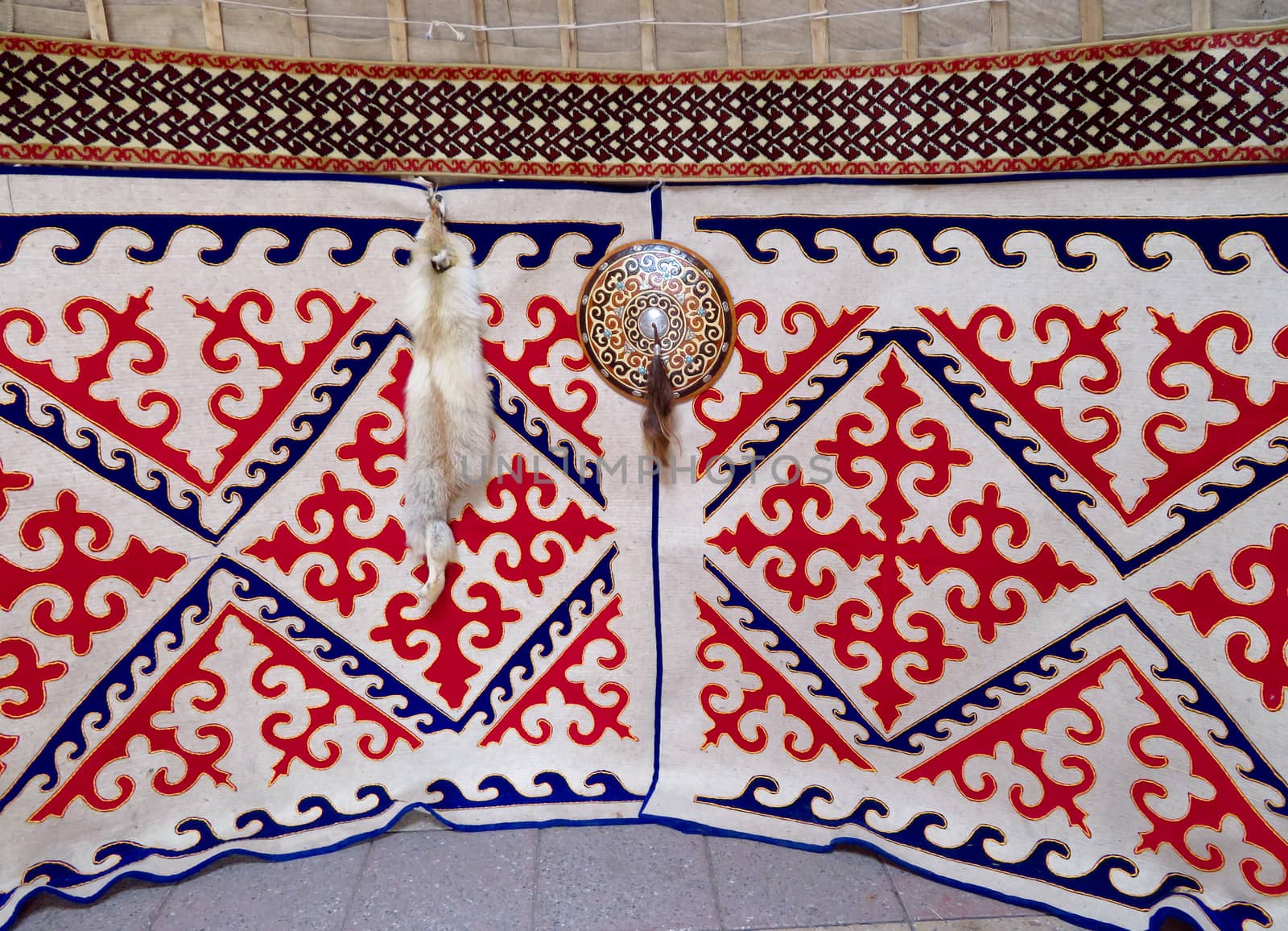 ALMATY, KAZAKHSTAN - MARCH 26, 2017: Kazakh felt carpet with ornament inside the yurt in Almaty, Kazakhstan

Almaty, Kazakhstan - March 26, 2017: Kazakh felt carpet with ornament inside the yurt in Almaty, Kazakhstan