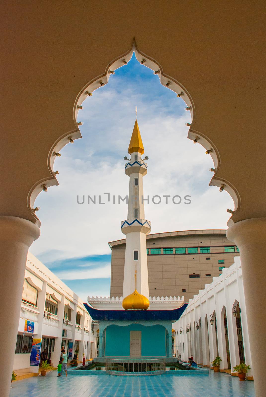 MIRI, SARAWAK, BORNEO, MALAYSIA - MARCH 2017: Beautiful Masjid At-Taqwa mosque with its Golden dome and palm trees. Miri city, Borneo, Sarawak