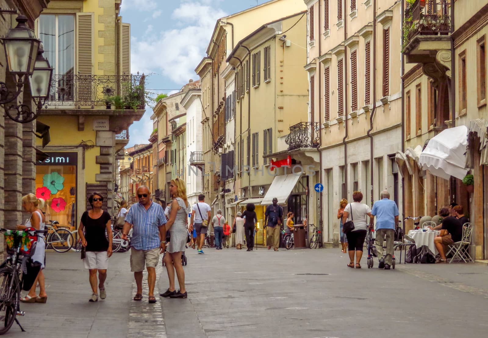 Rimini, Italy - June 14, 2017: Unrecognizable people are walking down the street in the old center of the Rimini