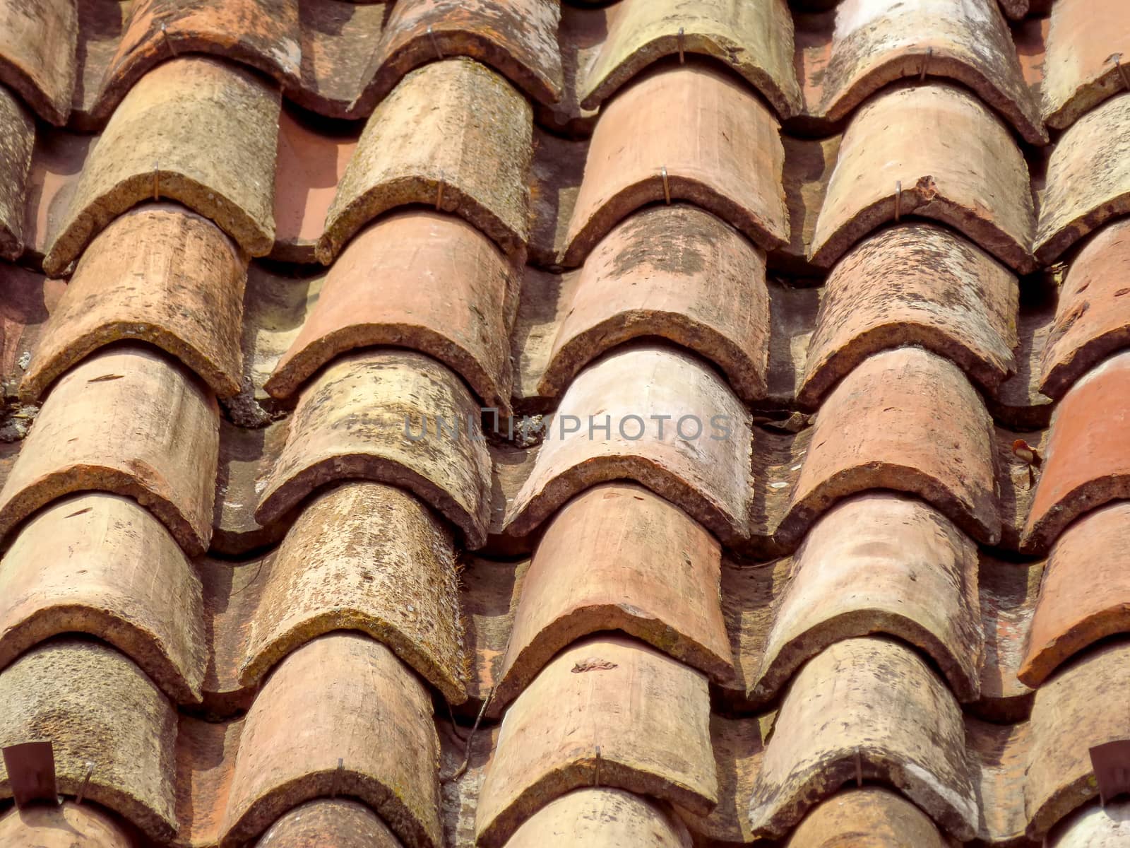 Closeup of old tile roof background in Italy