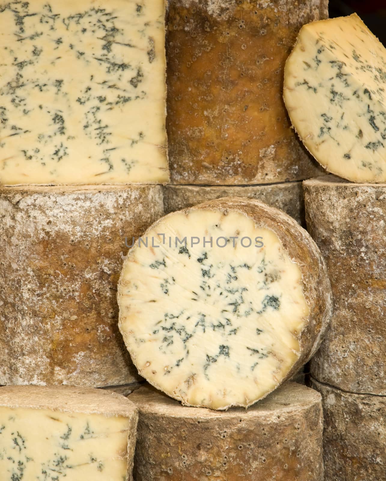 Wheels of blue cheese in a market