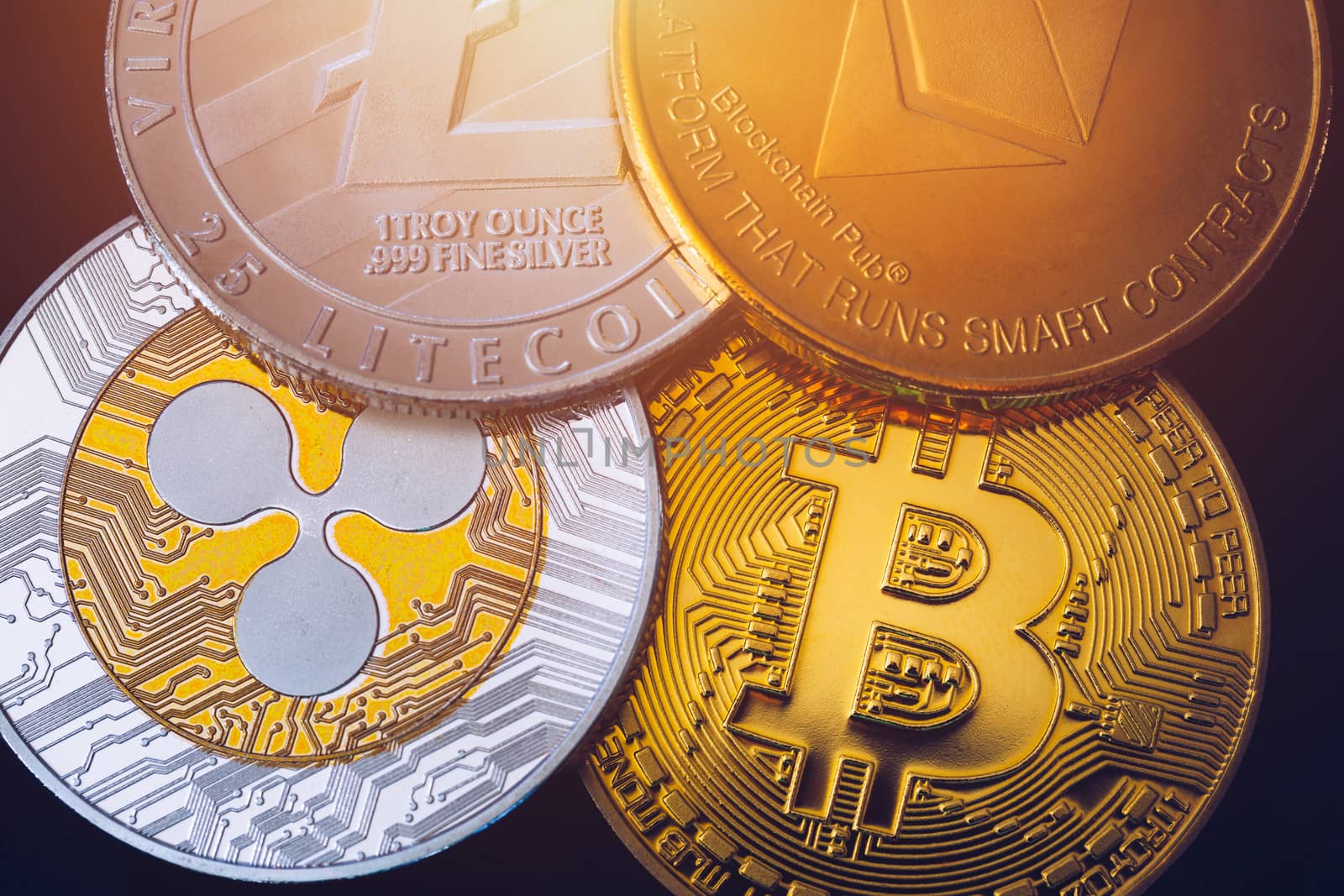 Set of cryptocurrencies with Bitcoin, Etherium, Ripple, Litecoin. Cryptocurrencys new digital money. Bitcoin on the front as the leader. Bitcoin as most important cryptocurrency.