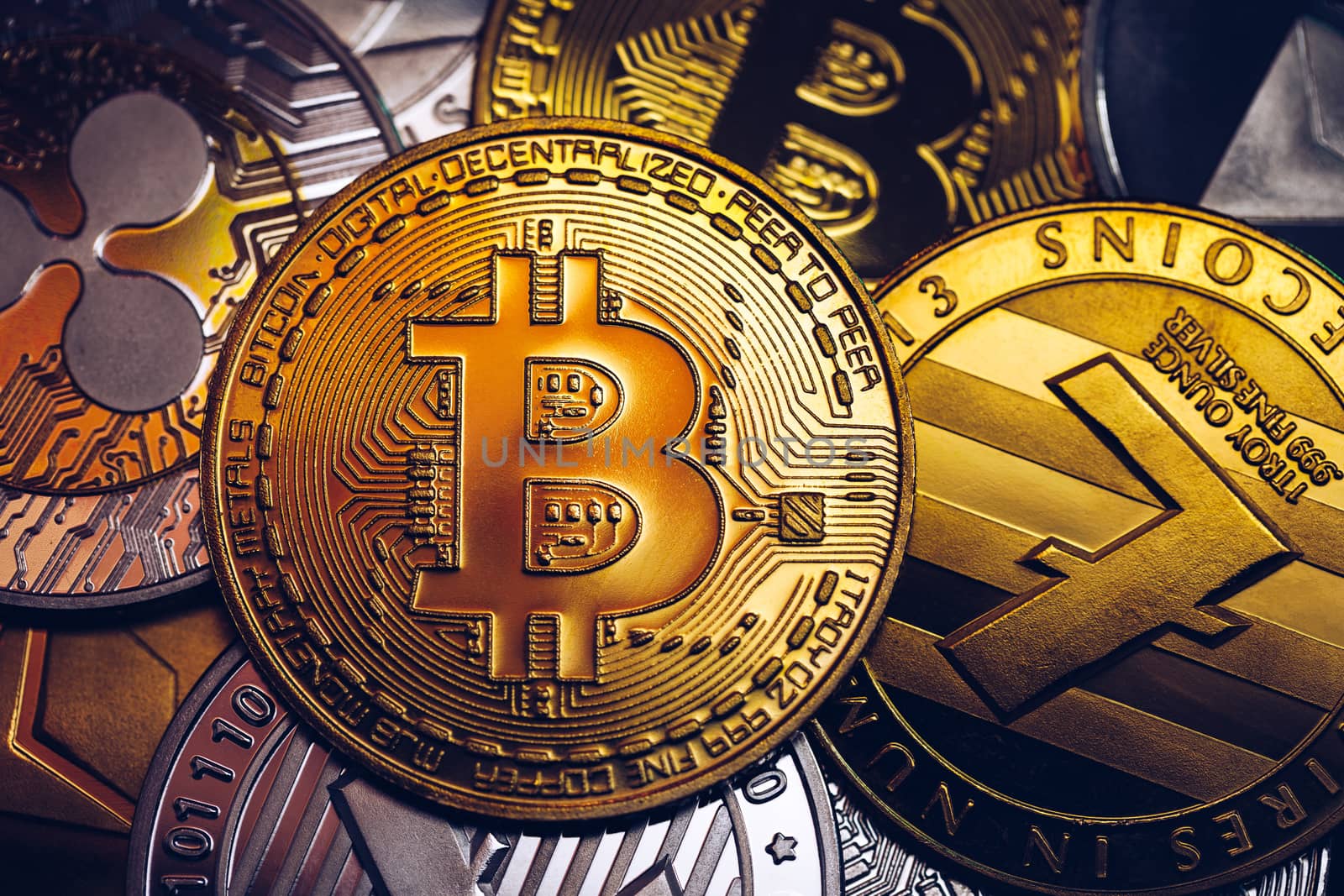 Set of cryptocurrencies with Bitcoin, Etherium, Ripple, Litecoin. Cryptocurrencys new digital money. Bitcoin on the front as the leader. Bitcoin as most important cryptocurrency.