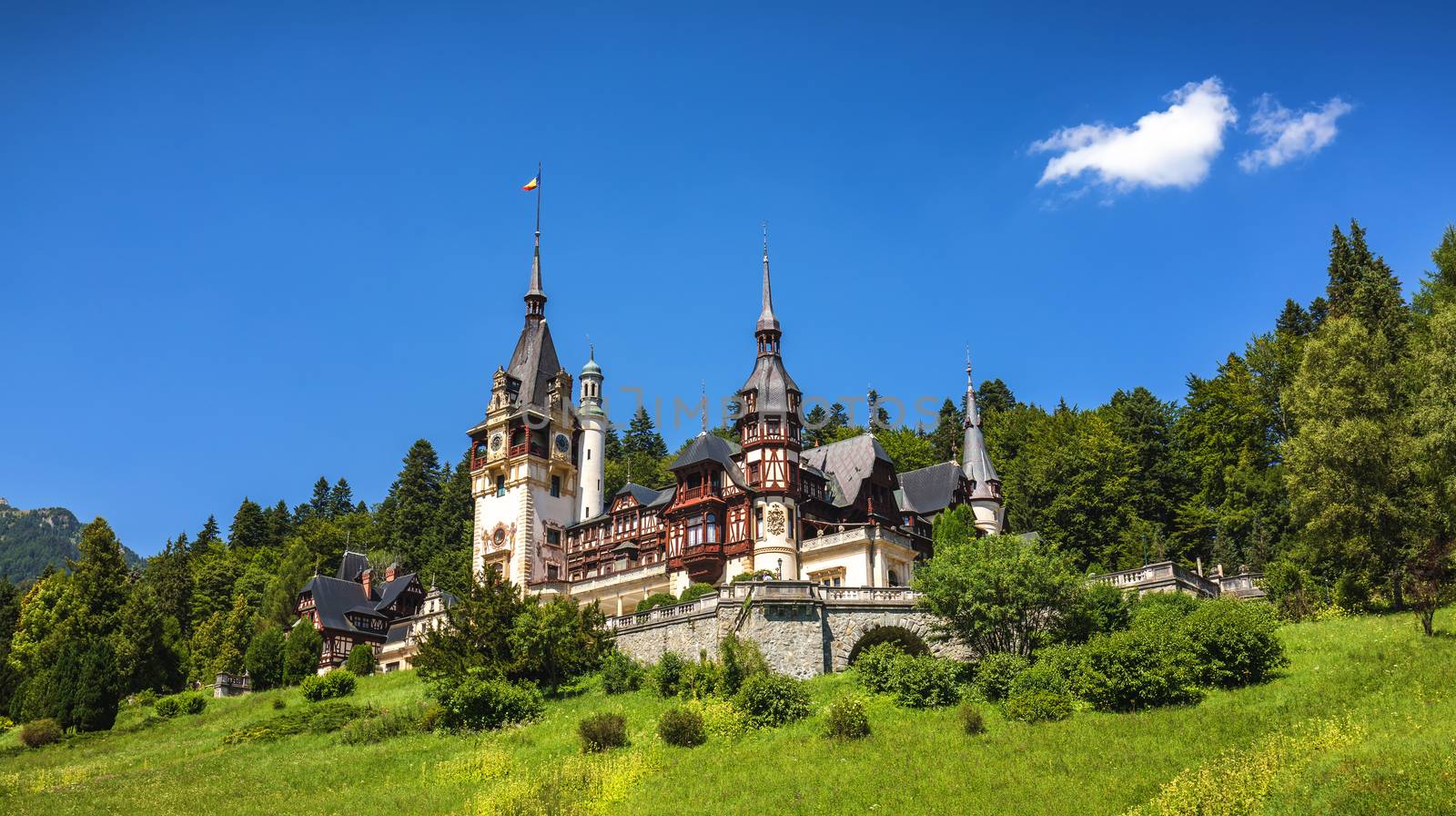 Peles Castle, Romania. Beautiful famous royal castle and ornamental garden in Sinaia landmark of Carpathian Mountains in Europe