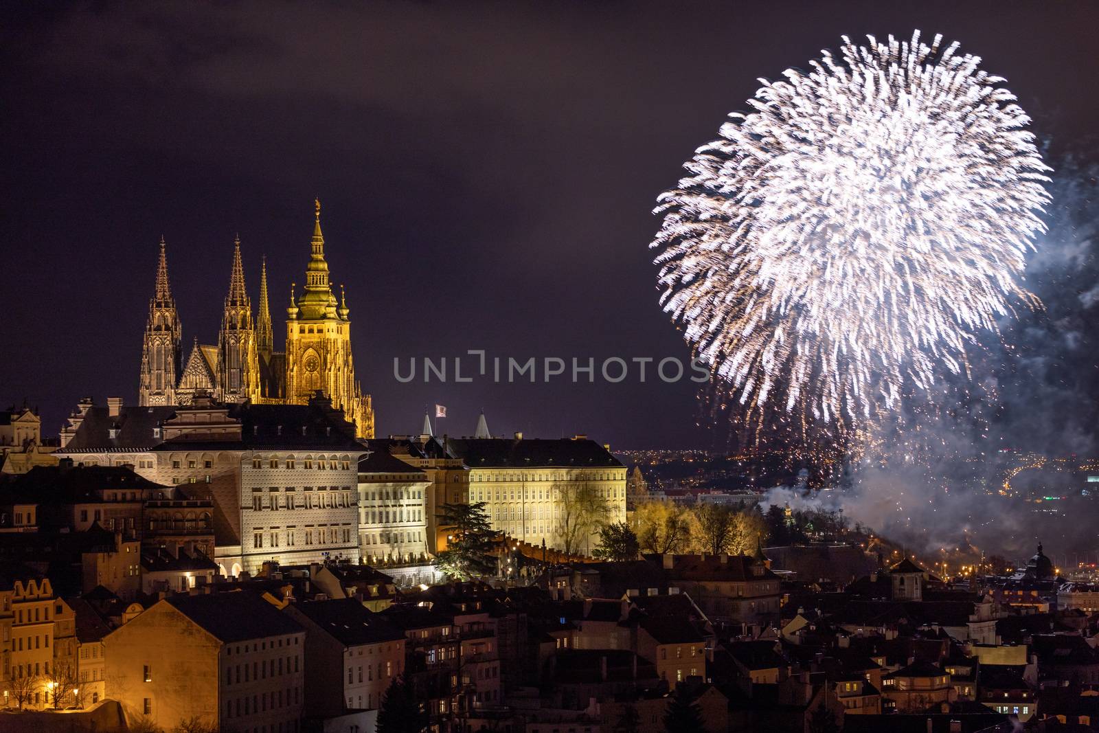 Fireworks over the Old Town of Prague, Czech Republic. New Year fireworks in Prague, Czechia. Prague fireworks during New Year Celebration near St. Vitus Cathedral, Prague, Czech republic.