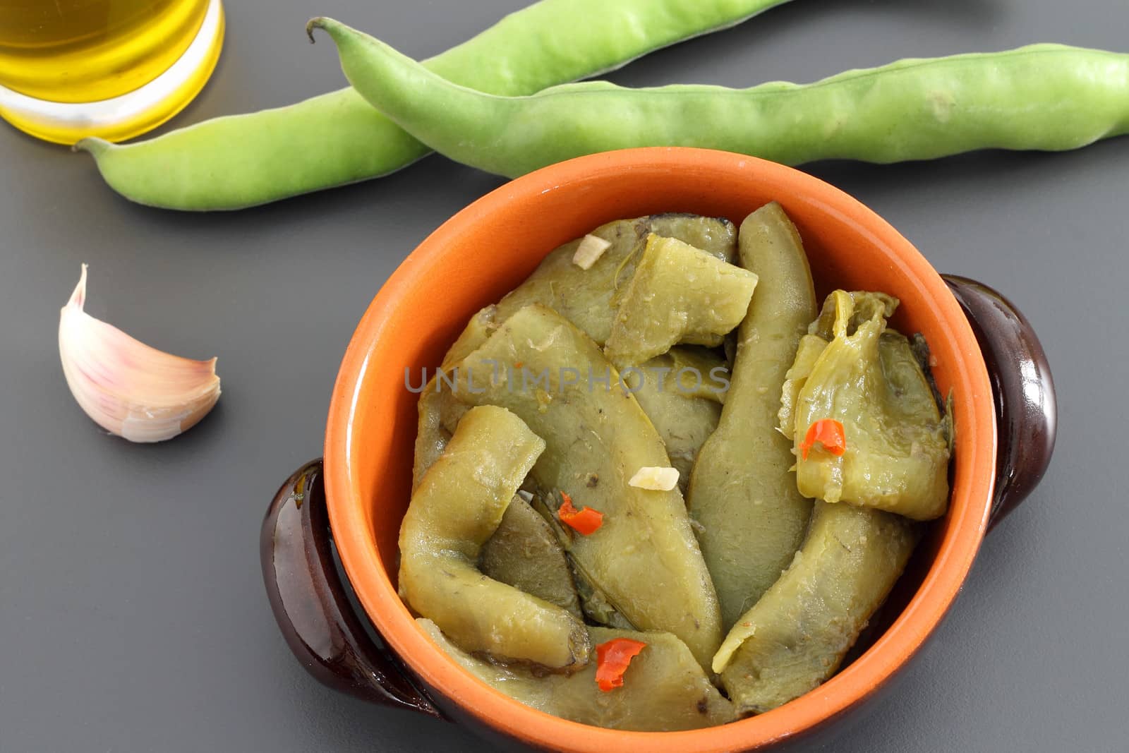 Cooked broad bean pods