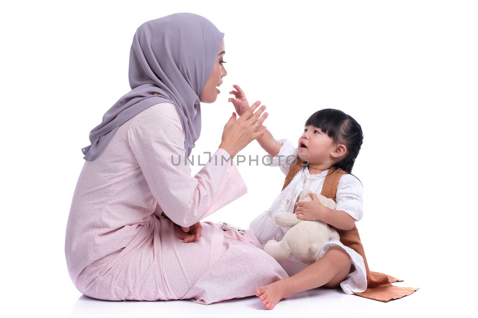happy muslim mother and her daughter