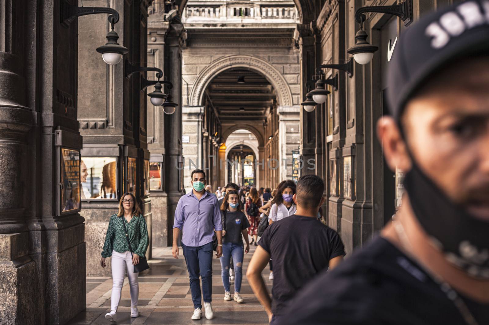 People walking under Bologna's Arcades in Italy 2 by pippocarlot