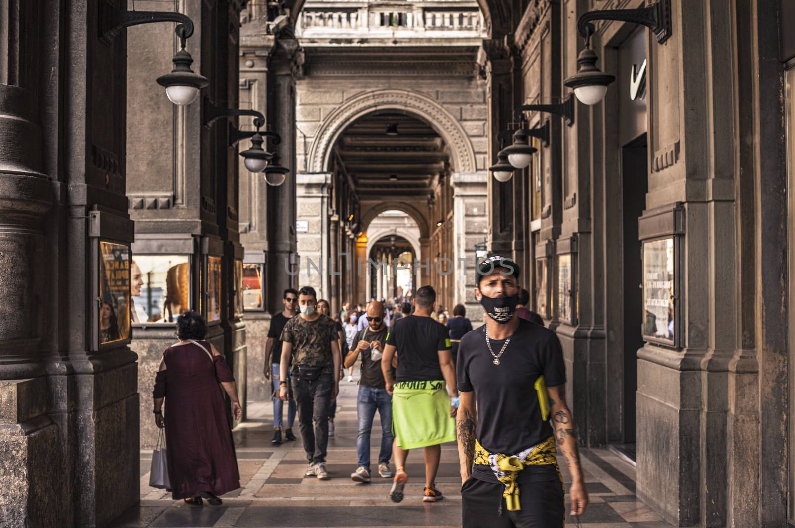 BOLOGNA, ITALY 17 JUNE 2020: People walking under Bologna's Arcades in Italy