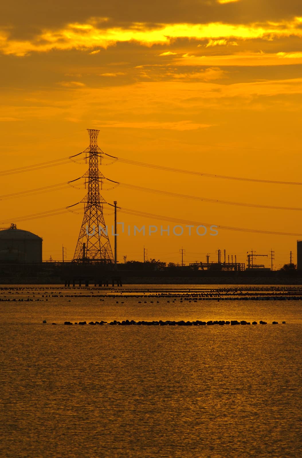 Coastal industrial estates with the evening sunlight by Satakorn