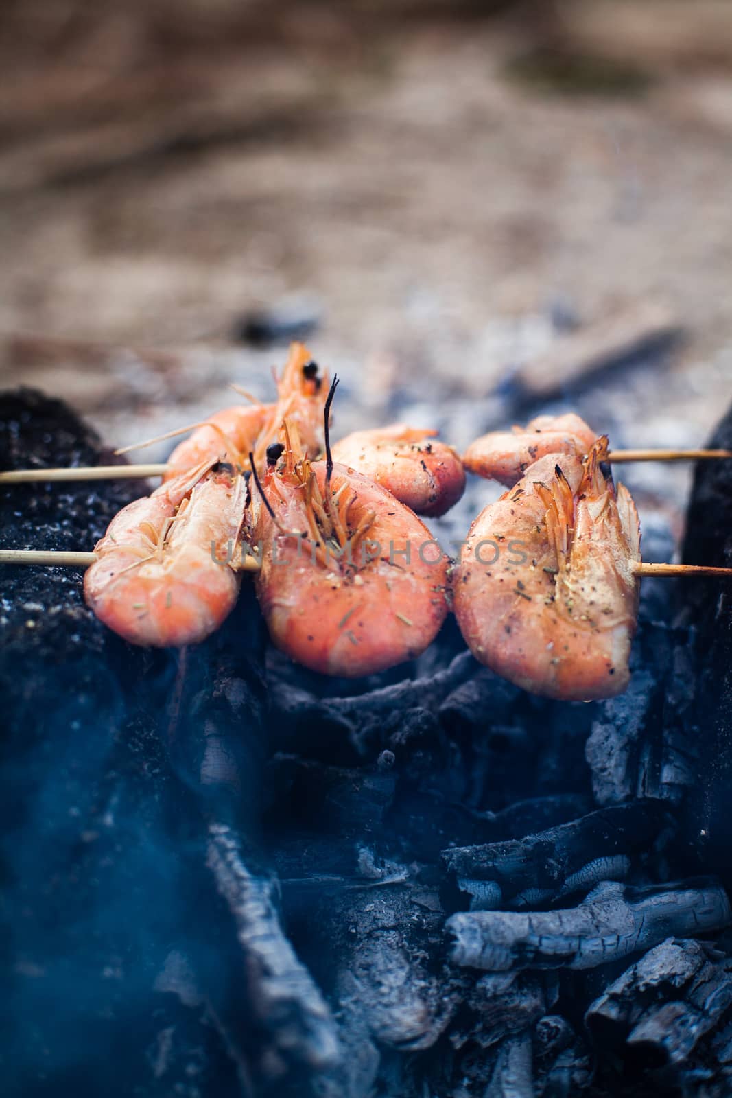 King prawns grilled on charcoal. Food outdoors. Cooking at the s by Opikanets