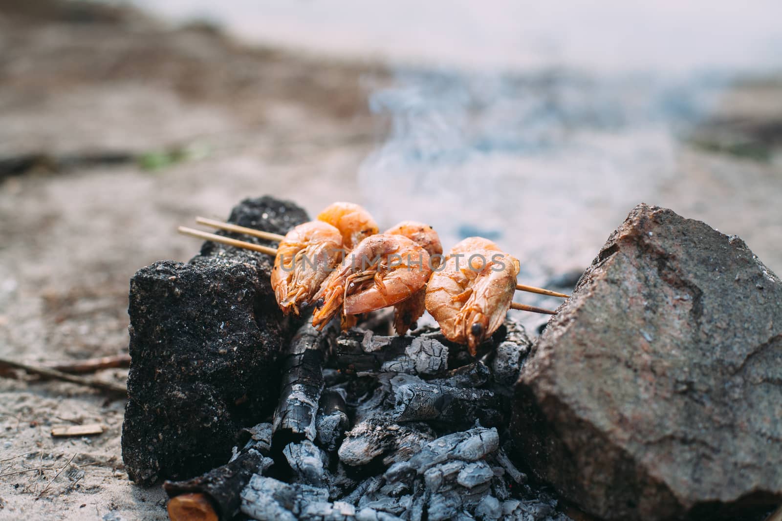 King prawns grilled on charcoal. Food outdoors. Cooking at the s by Opikanets