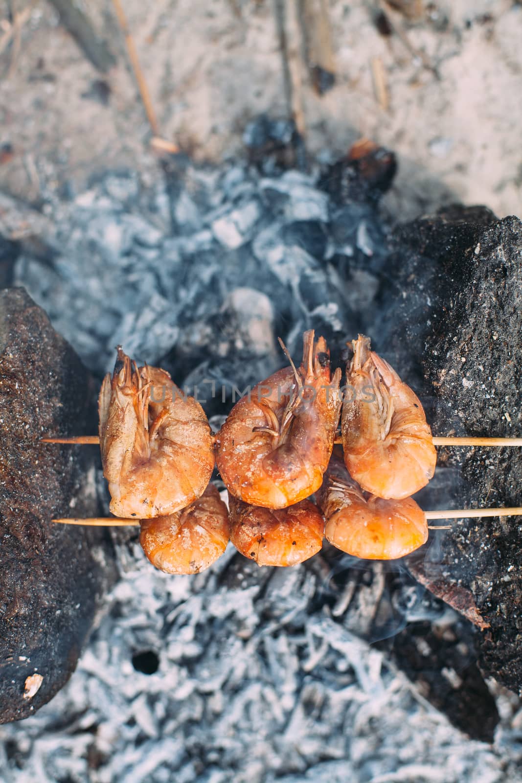 King prawns grilled on charcoal. Food outdoors. Cooking at the s by Opikanets