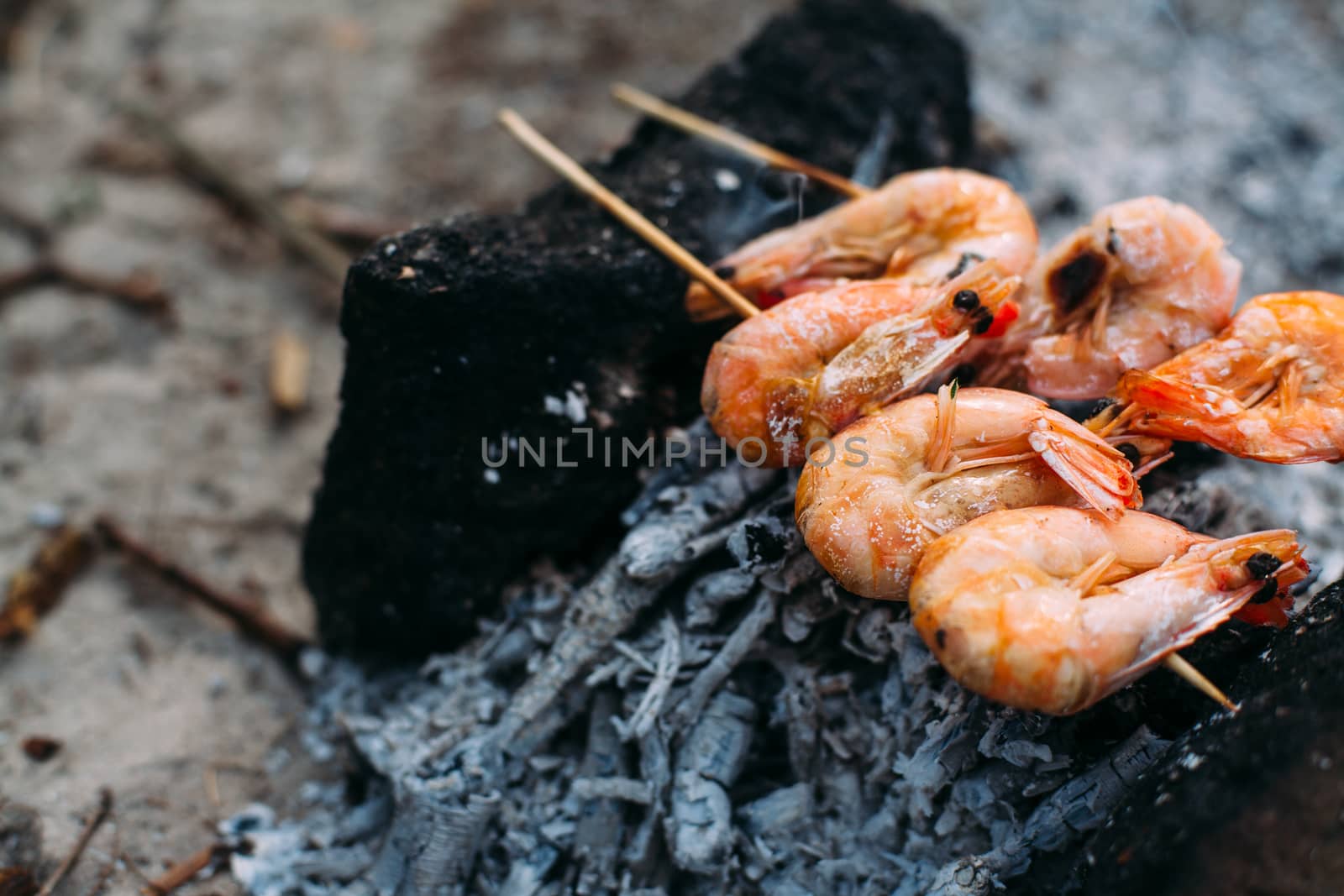 King prawns grilled on charcoal. Food outdoors. Cooking at the s by Opikanets