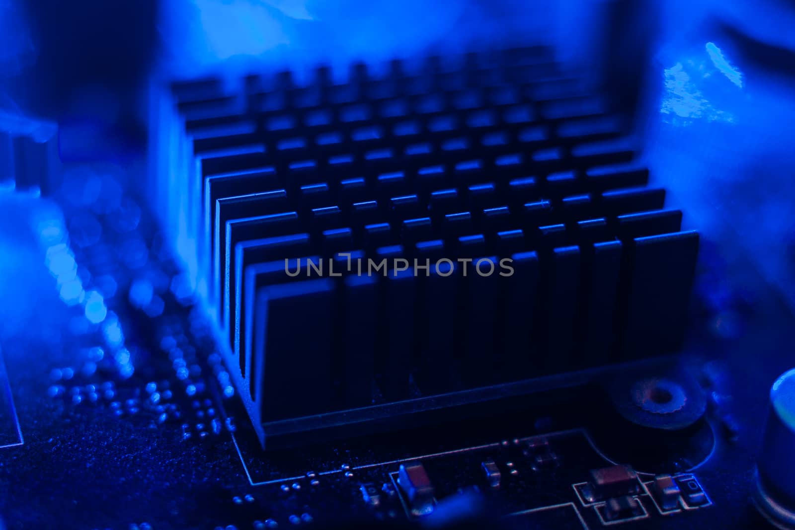 Motherboard radiator with blue backlight. Electronics in neon li by Opikanets