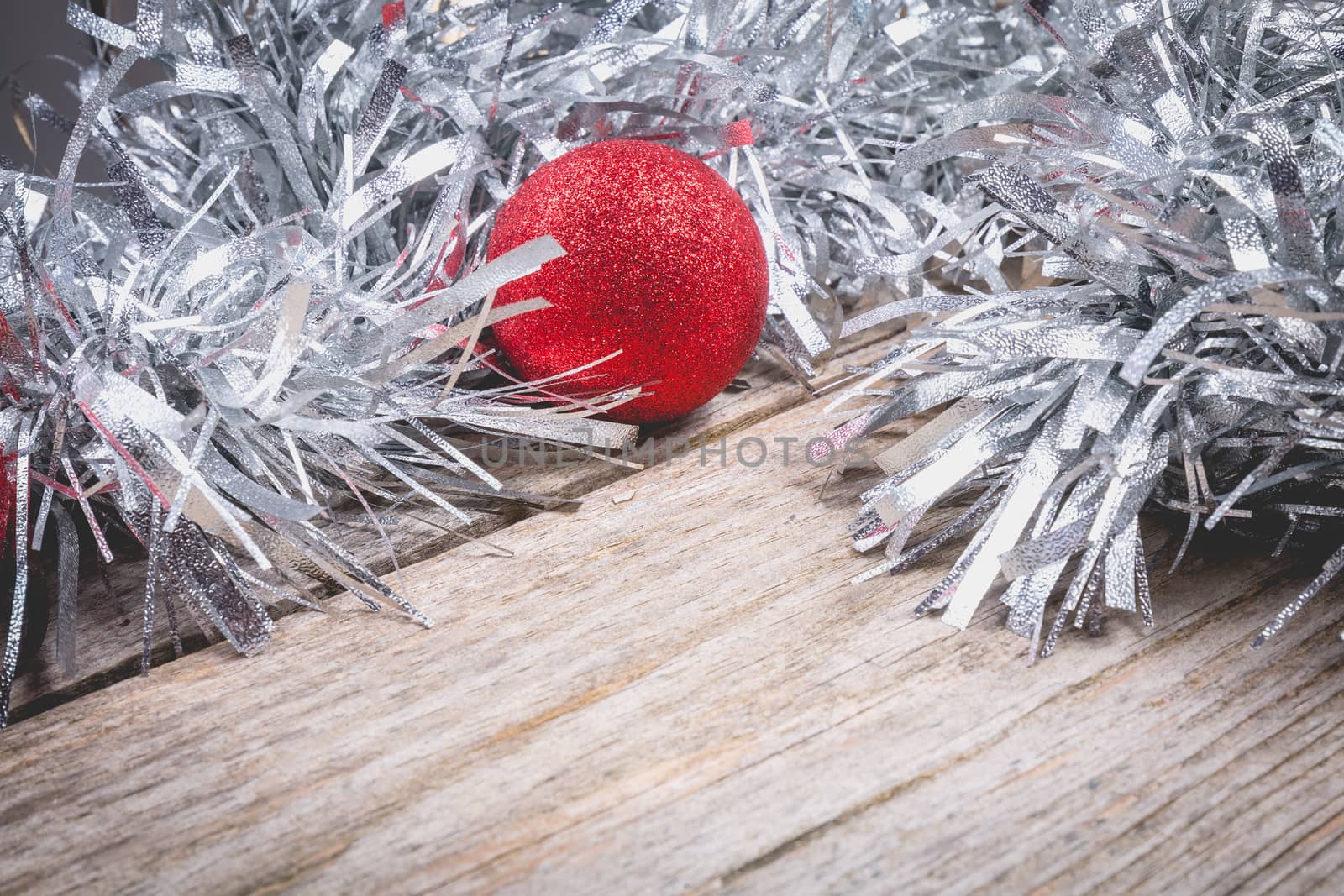 merry christmas concept with grey decoration on old wooden board