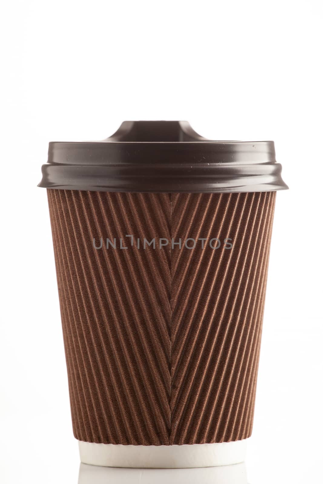 Paper brown corrugated cup on a white background with a lid. A glass for hot drinks. Takeaway drinks