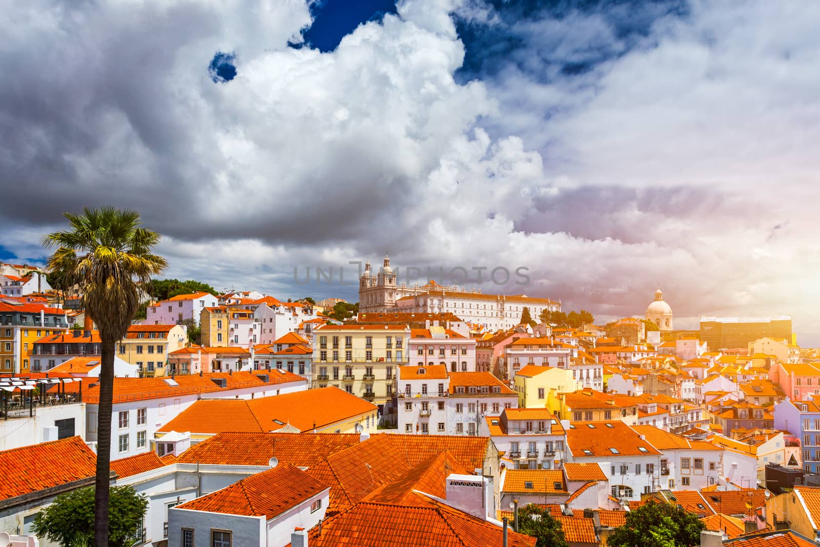 Lisbon, Portugal city skyline over the Alfama district. Summertime sunshine day cityscape in the Alfama, historic old district Alfama in Lisbon, Portugal. Lisbon cityscape in the Alfama District. 