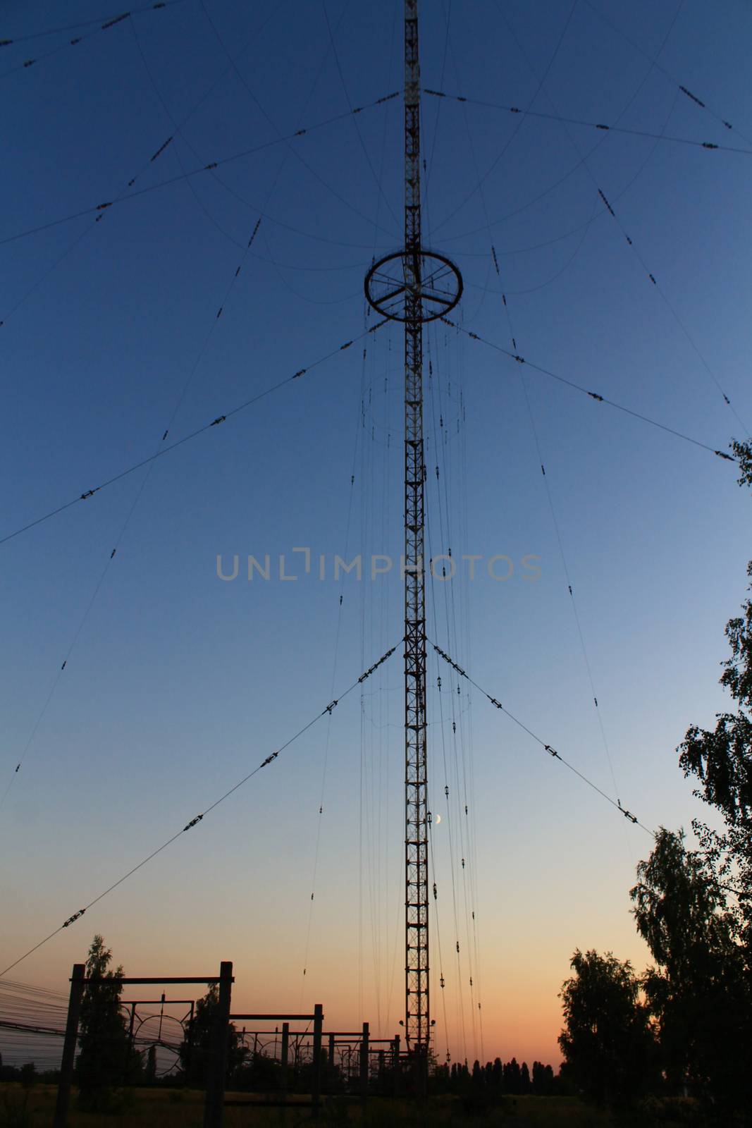 Radio and television tower on the background of the sunset and t by Opikanets